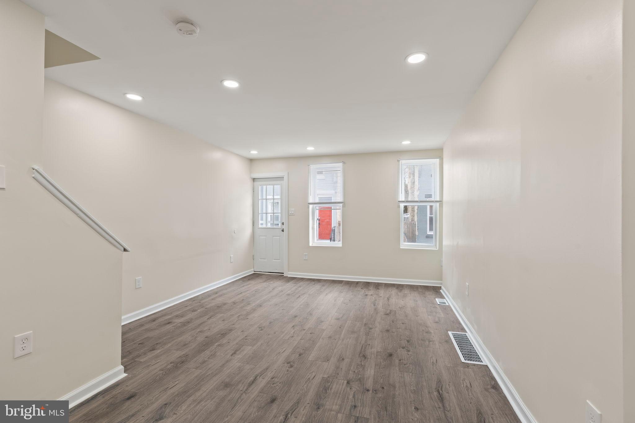 1840 North Taylor Street Philadelphia, PA 19121 - Photo 6 of 29 an empty room with wooden floor and windows