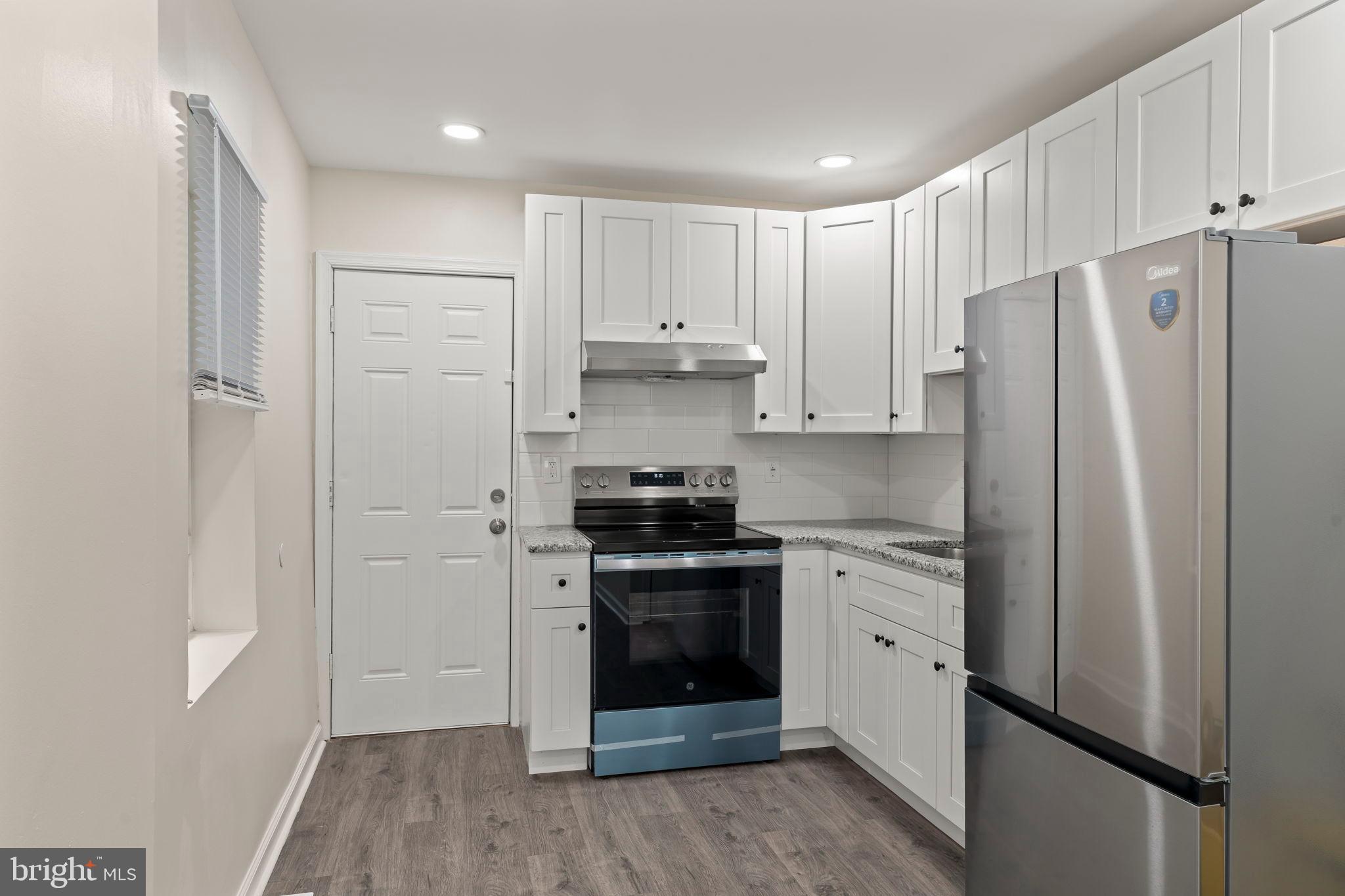 1840 North Taylor Street Philadelphia, PA 19121 - Photo 7 of 29 a kitchen with stainless steel appliances a refrigerator sink and cabinets