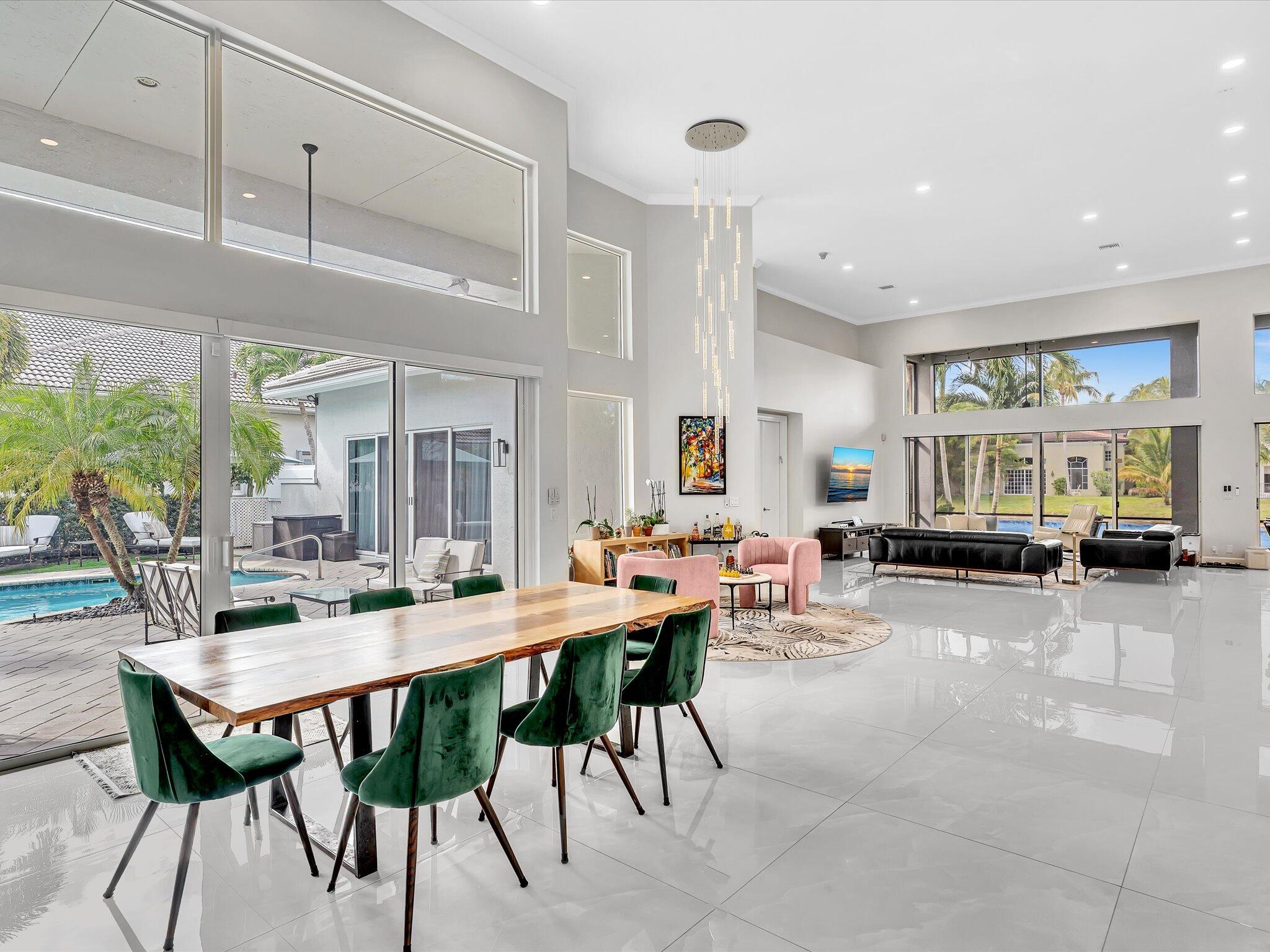 6485 Northwest 32nd Way Boca Raton, FL 33496 - Photo 23 of 54 a view of a dining room with furniture window and wooden floor