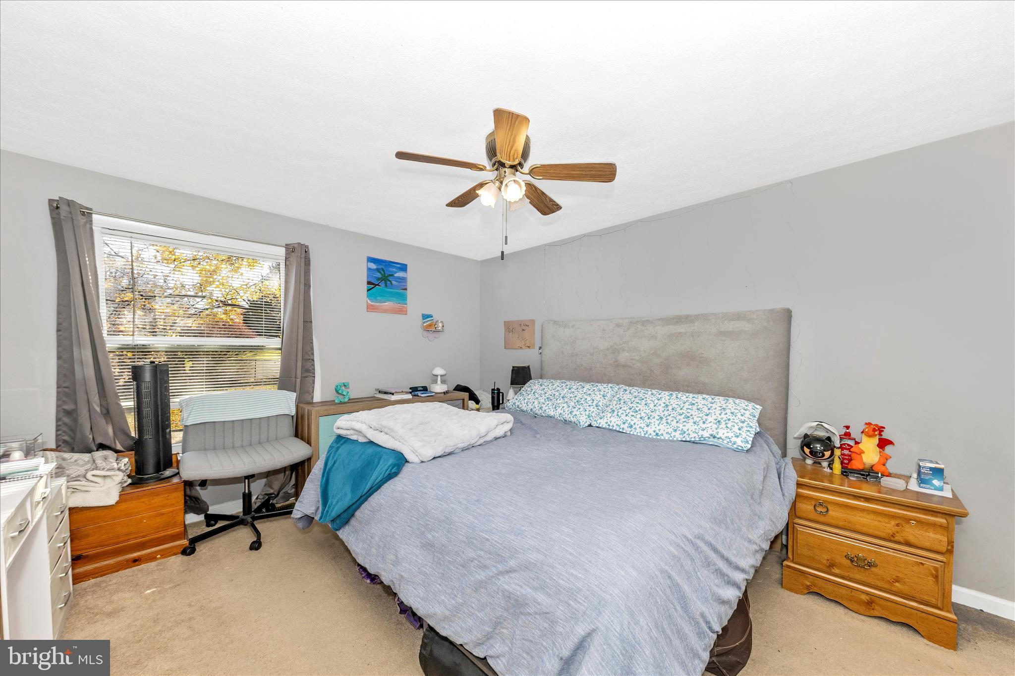 7129 Limestone Lane Middletown, MD 21769 - Photo 16 of 37 a bedroom with a bed and a chandelier