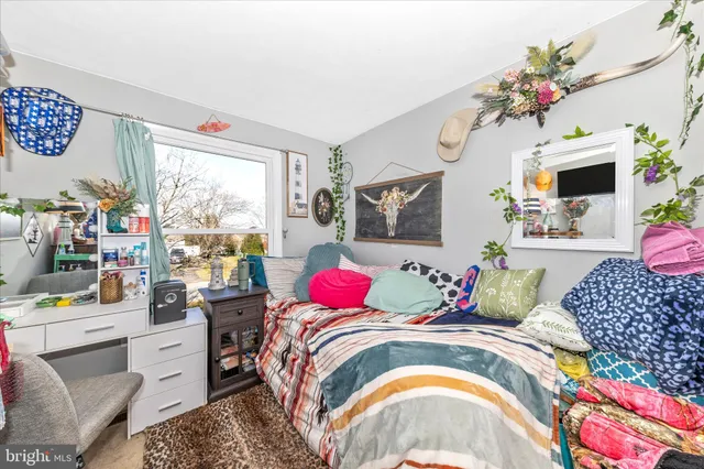 a bedroom with a bed and a couch