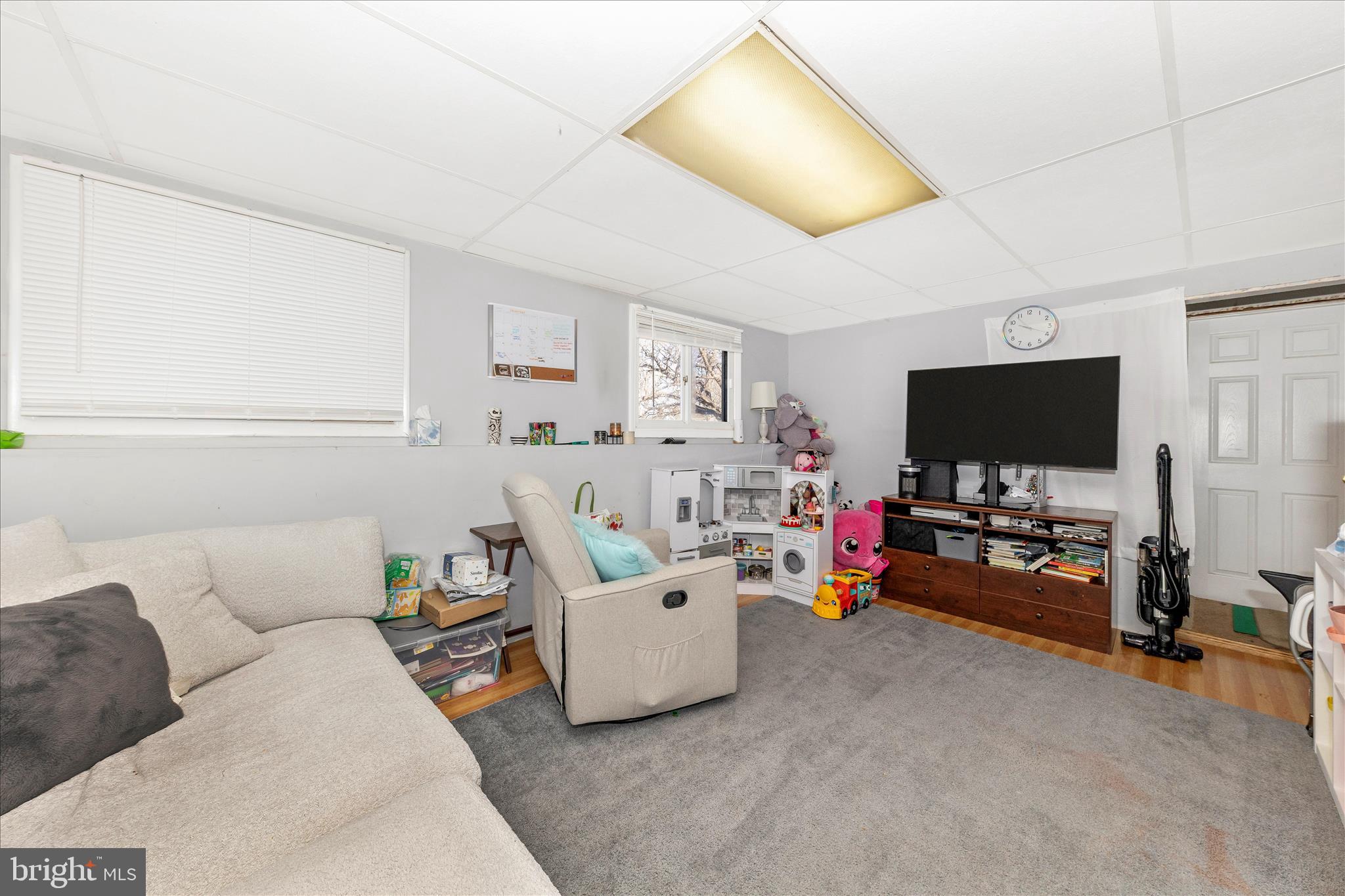 7129 Limestone Lane Middletown, MD 21769 - Photo 26 of 37 a living room with furniture and a flat screen tv