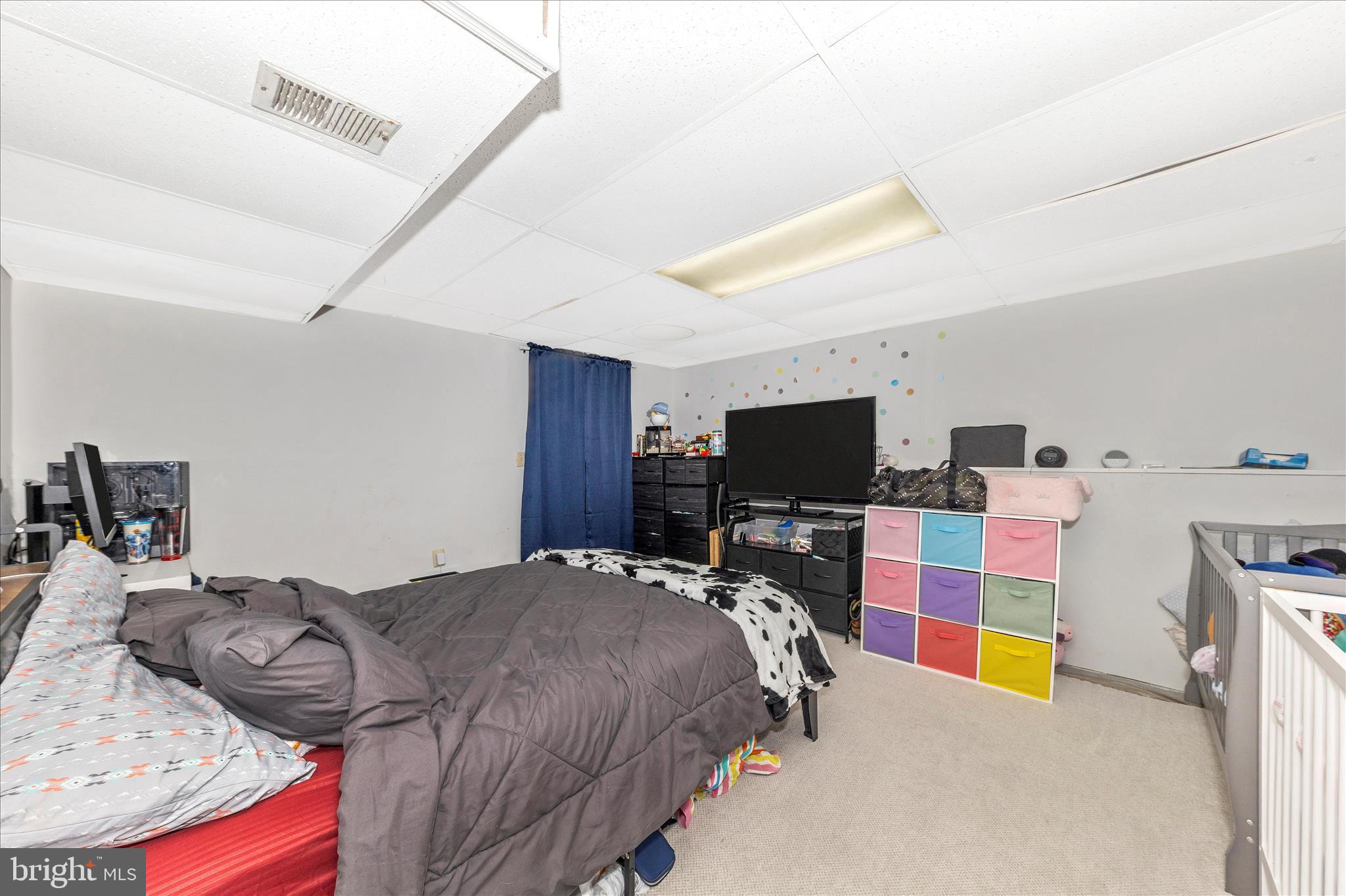 7129 Limestone Lane Middletown, MD 21769 - Photo 28 of 37 a bedroom with a bed and a flat screen tv
