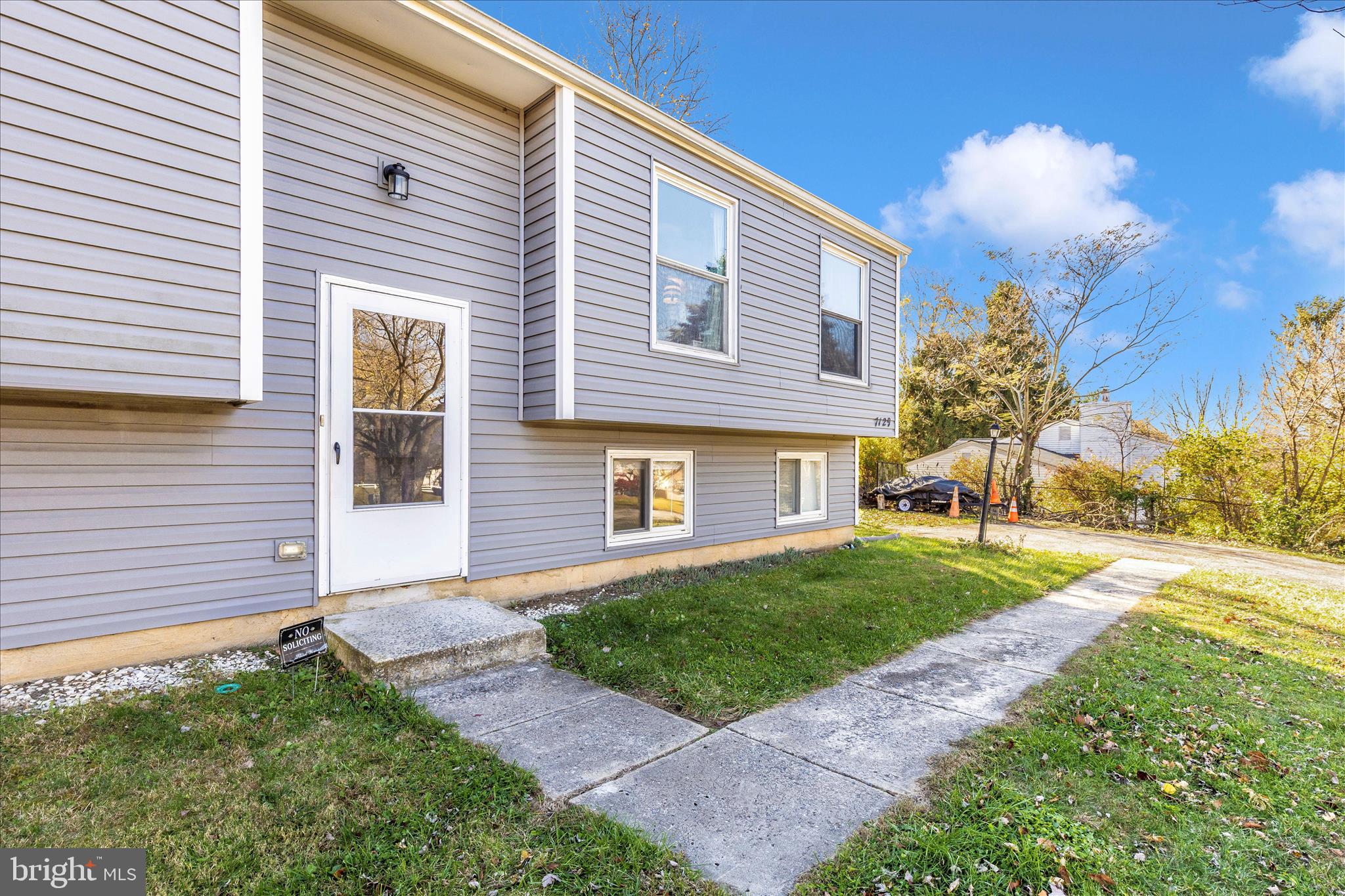 7129 Limestone Lane Middletown, MD 21769 - Photo 3 of 37 a front view of a house with a yard and garage