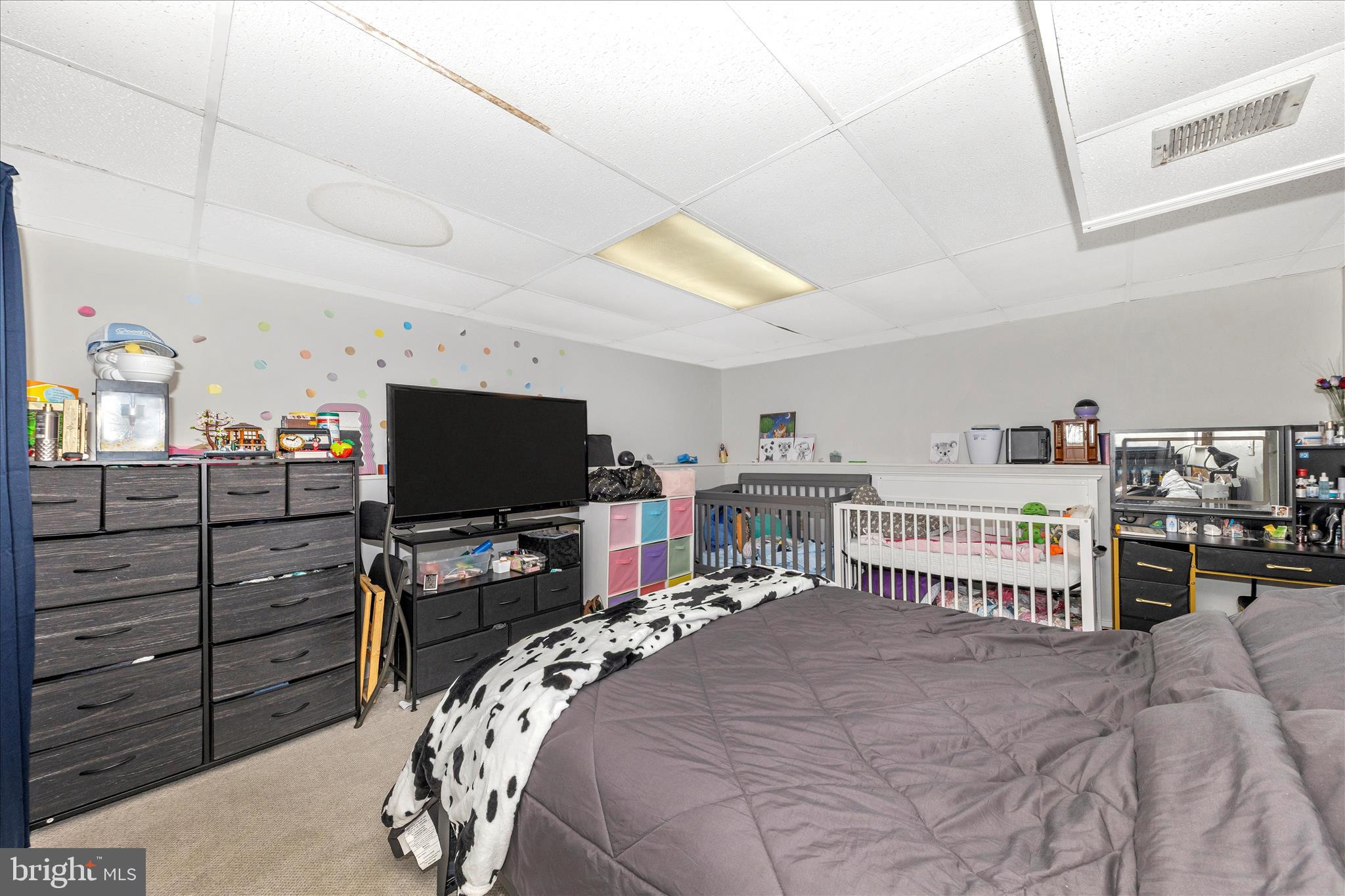7129 Limestone Lane Middletown, MD 21769 - Photo 31 of 37 a bedroom with a bed and a flat screen tv