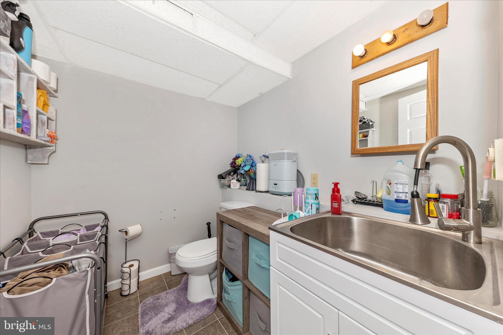 7129 Limestone Lane Middletown, MD 21769 - Photo 32 of 37 a bathroom with a sink and a toilet