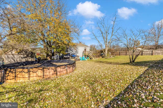 a view of open space with yard