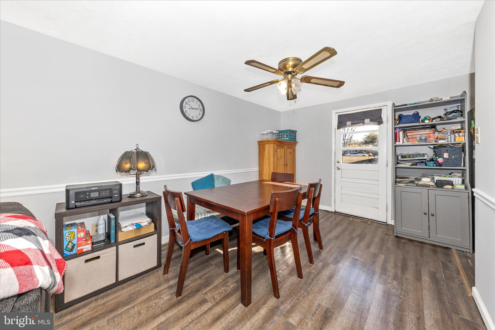 7129 Limestone Lane Middletown, MD 21769 - Photo 7 of 37 a dining room with a wooden table and chairs