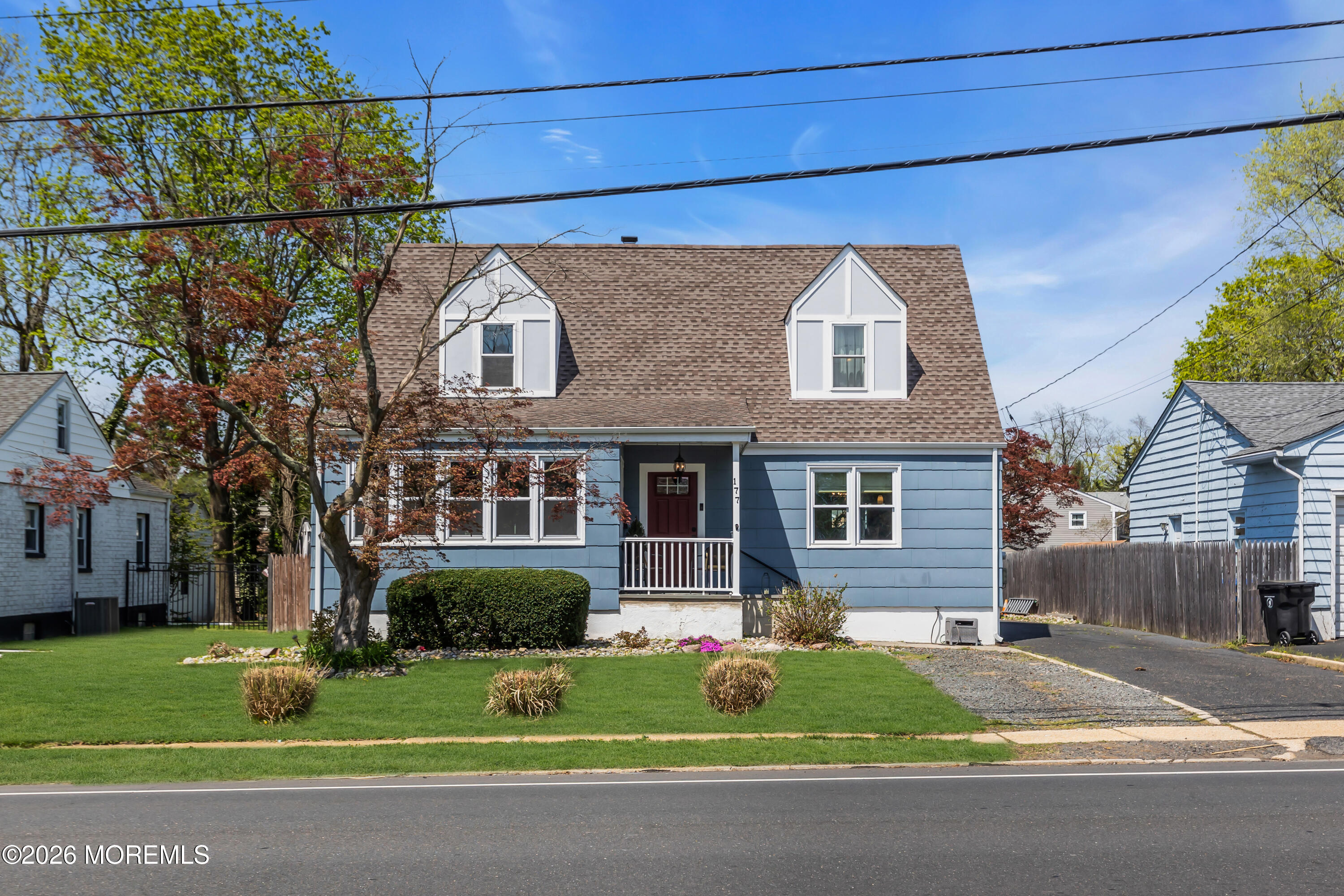 177 Navesink River Road Red Bank, NJ 07701 - Photo 1 of 48 a front view of a house with a yard and garage