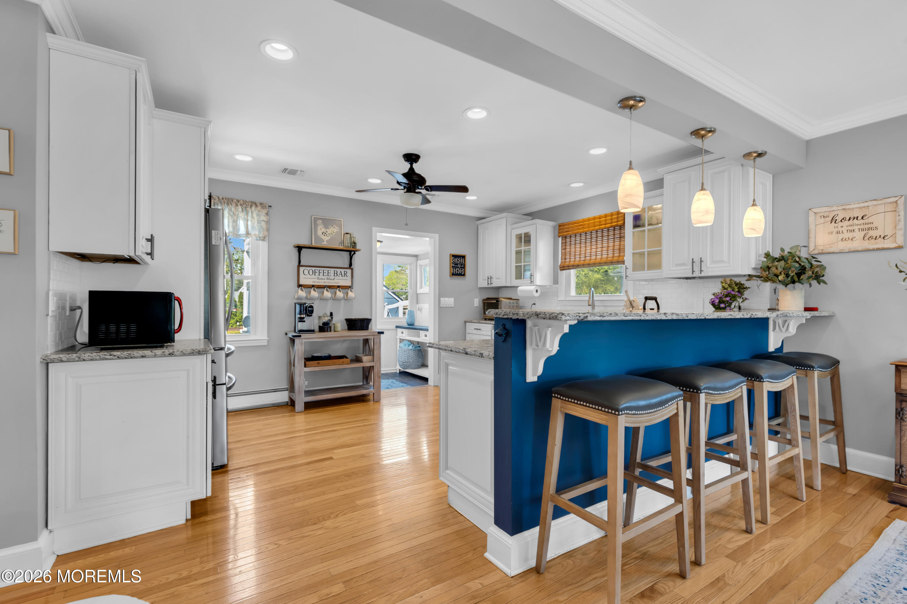 177 Navesink River Road Red Bank, NJ 07701 - Photo 17 of 48 a kitchen with stainless steel appliances kitchen island granite countertop a table and chairs in it