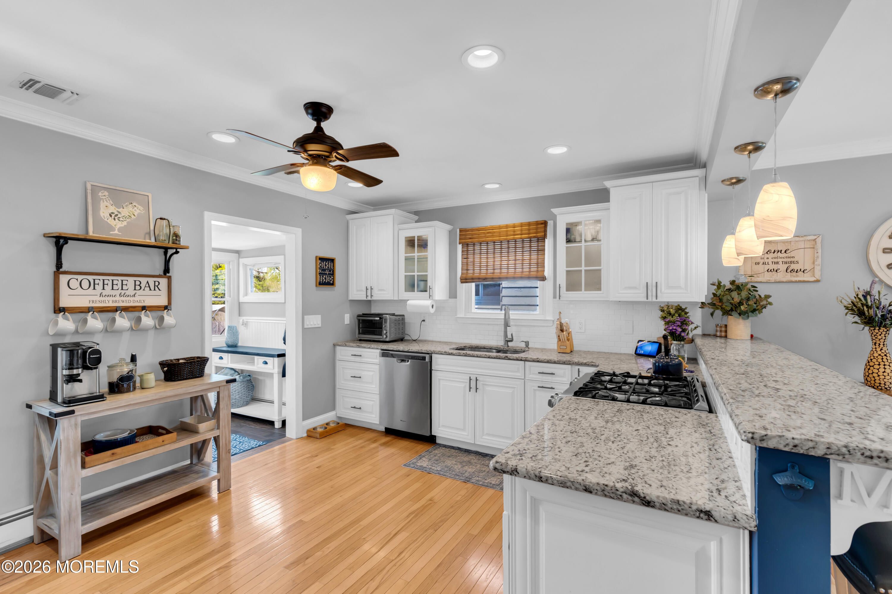 177 Navesink River Road Red Bank, NJ 07701 - Photo 20 of 48 a kitchen with granite countertop kitchen island sink stove and white cabinets