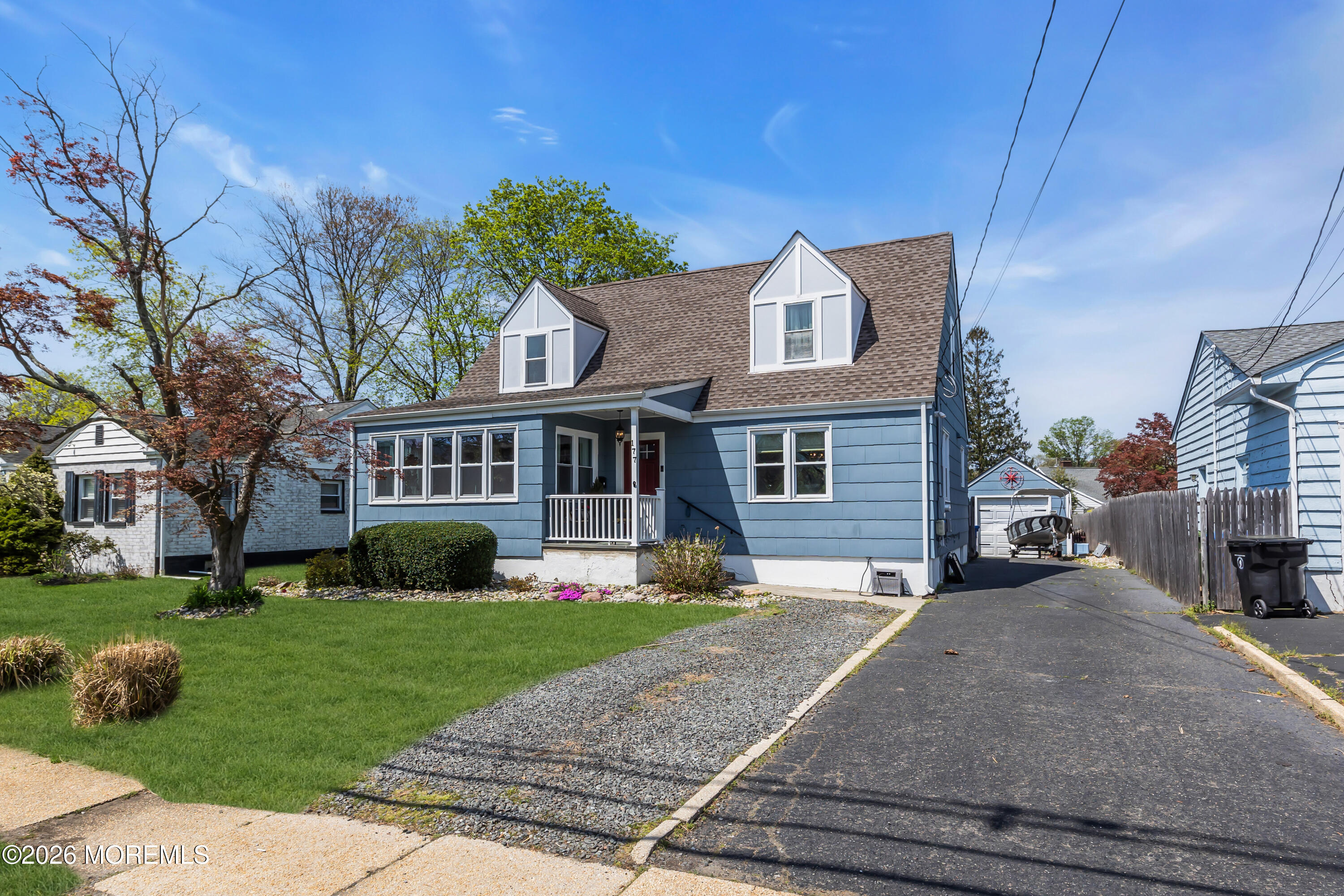 177 Navesink River Road Red Bank, NJ 07701 - Photo 2 of 48 a front view of a house with a yard and garage