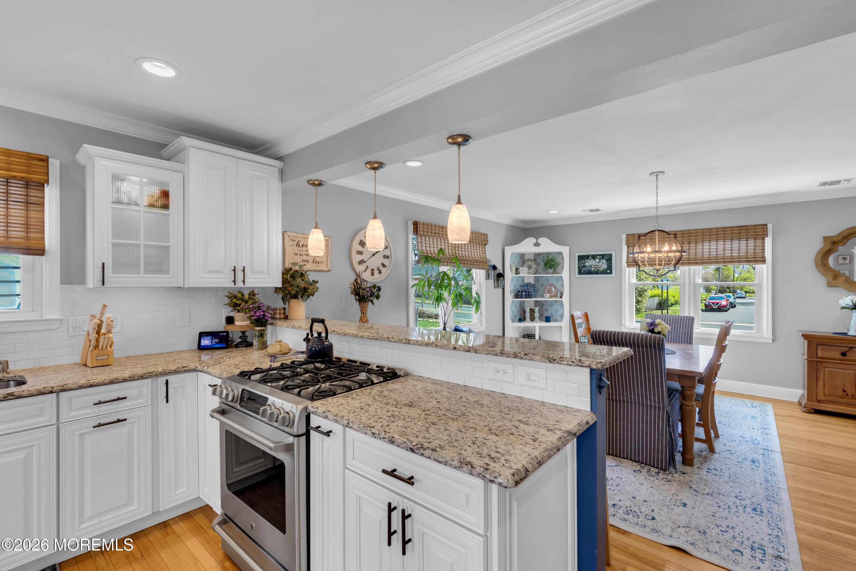 177 Navesink River Road Red Bank, NJ 07701 - Photo 21 of 48 a kitchen with a stove a sink a dining table and chairs