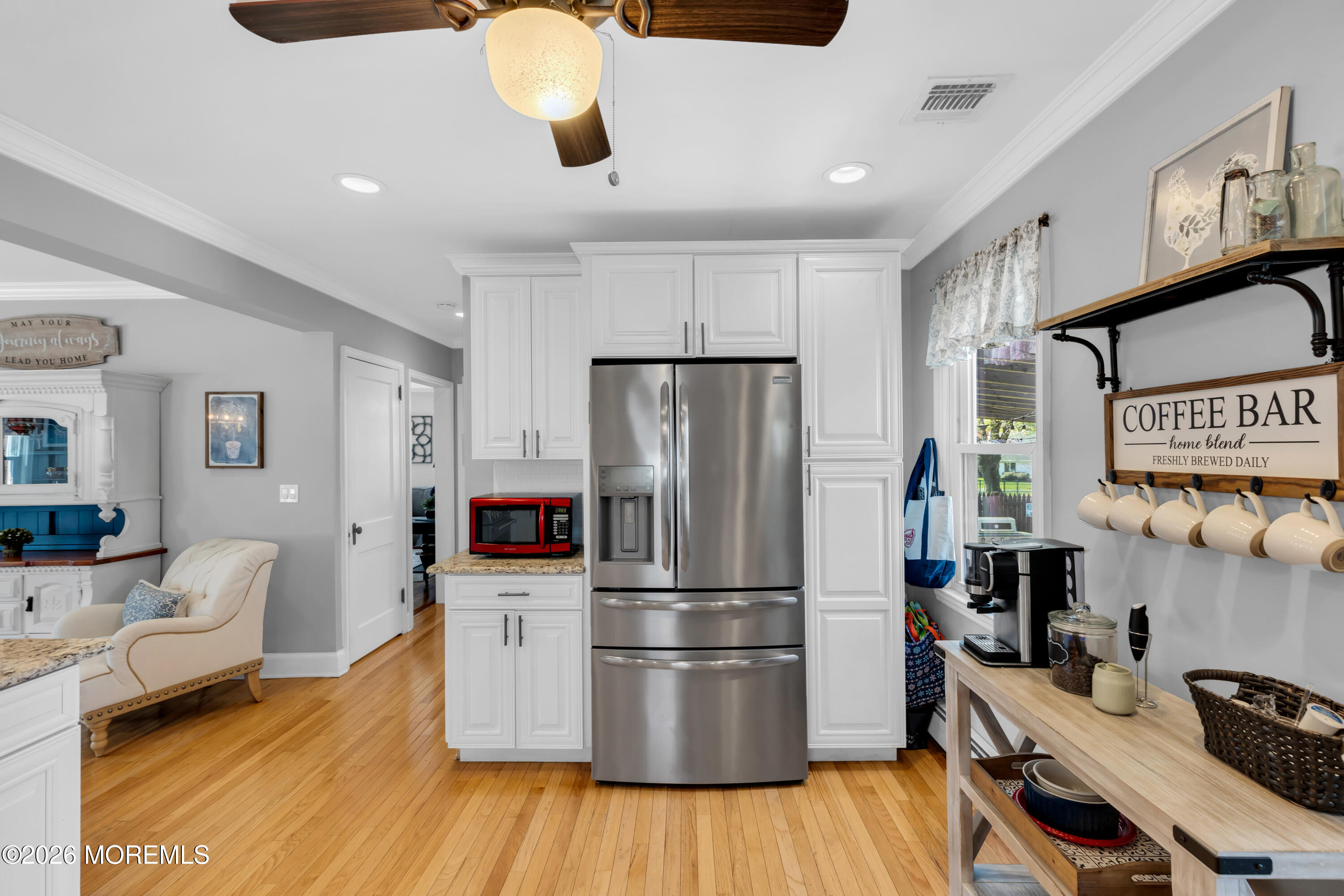 177 Navesink River Road Red Bank, NJ 07701 - Photo 23 of 48 a kitchen with stainless steel appliances granite countertop a refrigerator a stove a sink dishwasher and wooden floor