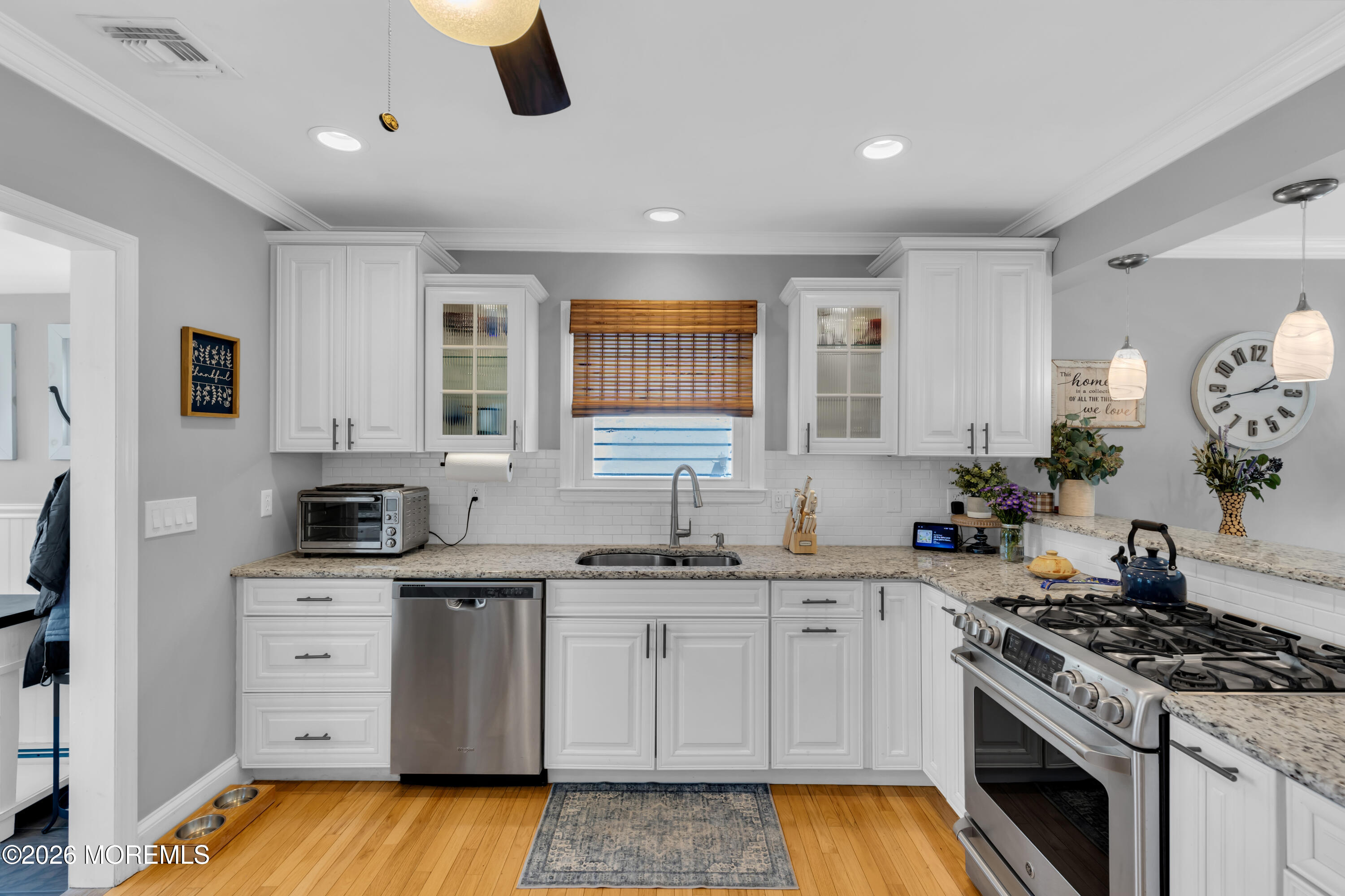 177 Navesink River Road Red Bank, NJ 07701 - Photo 27 of 48 a kitchen with a stove sink and cabinets