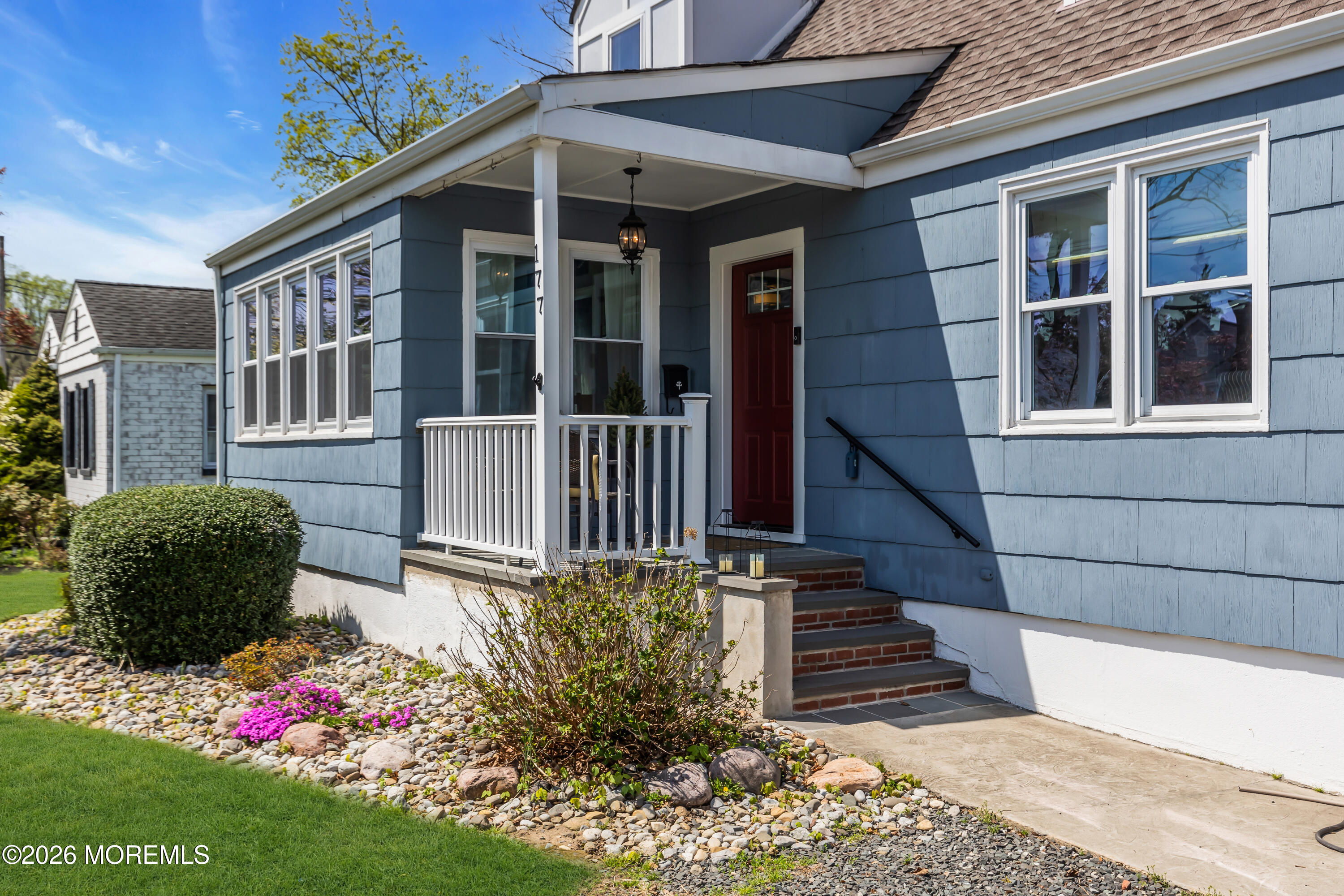 177 Navesink River Road Red Bank, NJ 07701 - Photo 3 of 48 a front view of a house with a garden