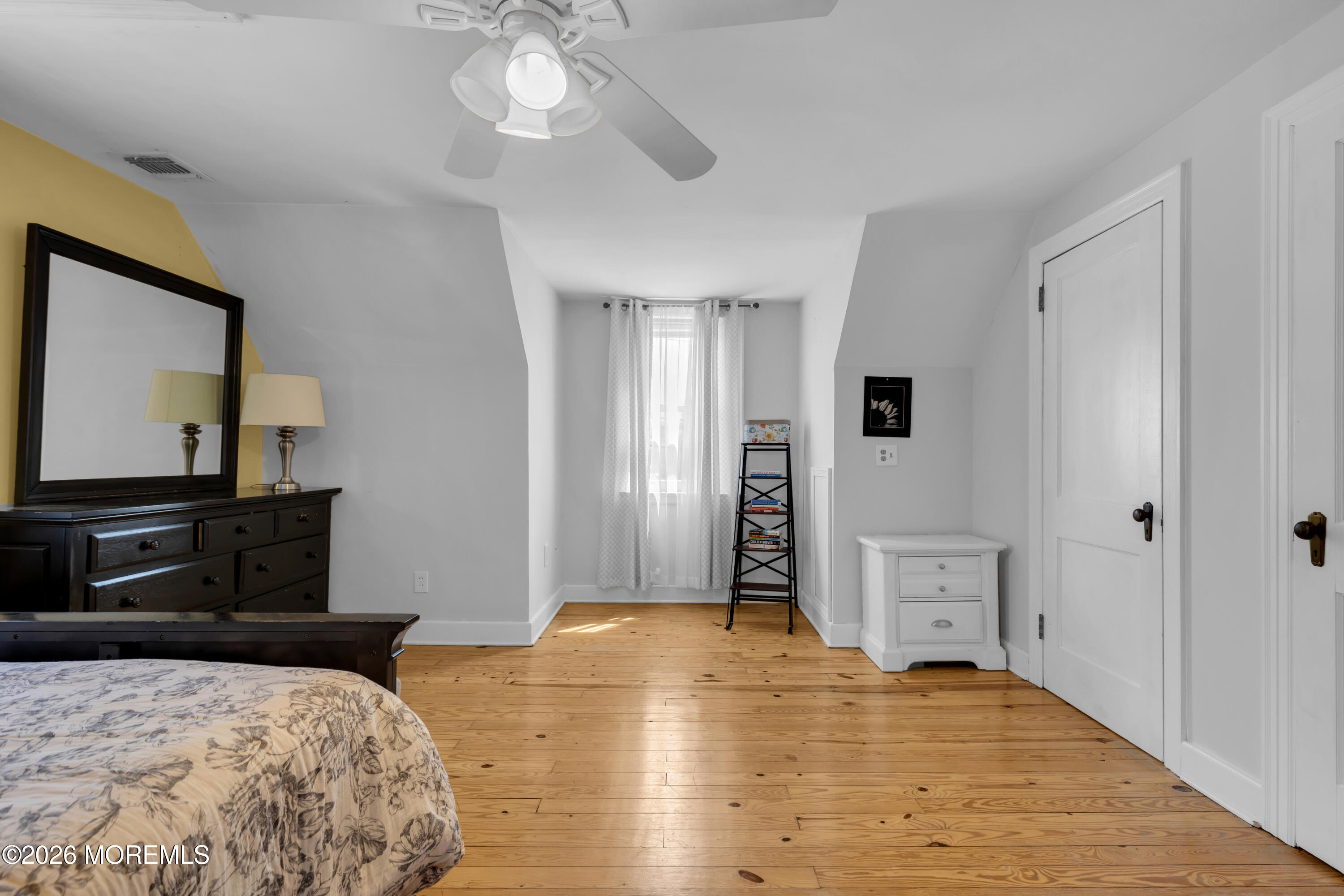 177 Navesink River Road Red Bank, NJ 07701 - Photo 32 of 48 a bedroom with a bed and a flat tv screen on dresser
