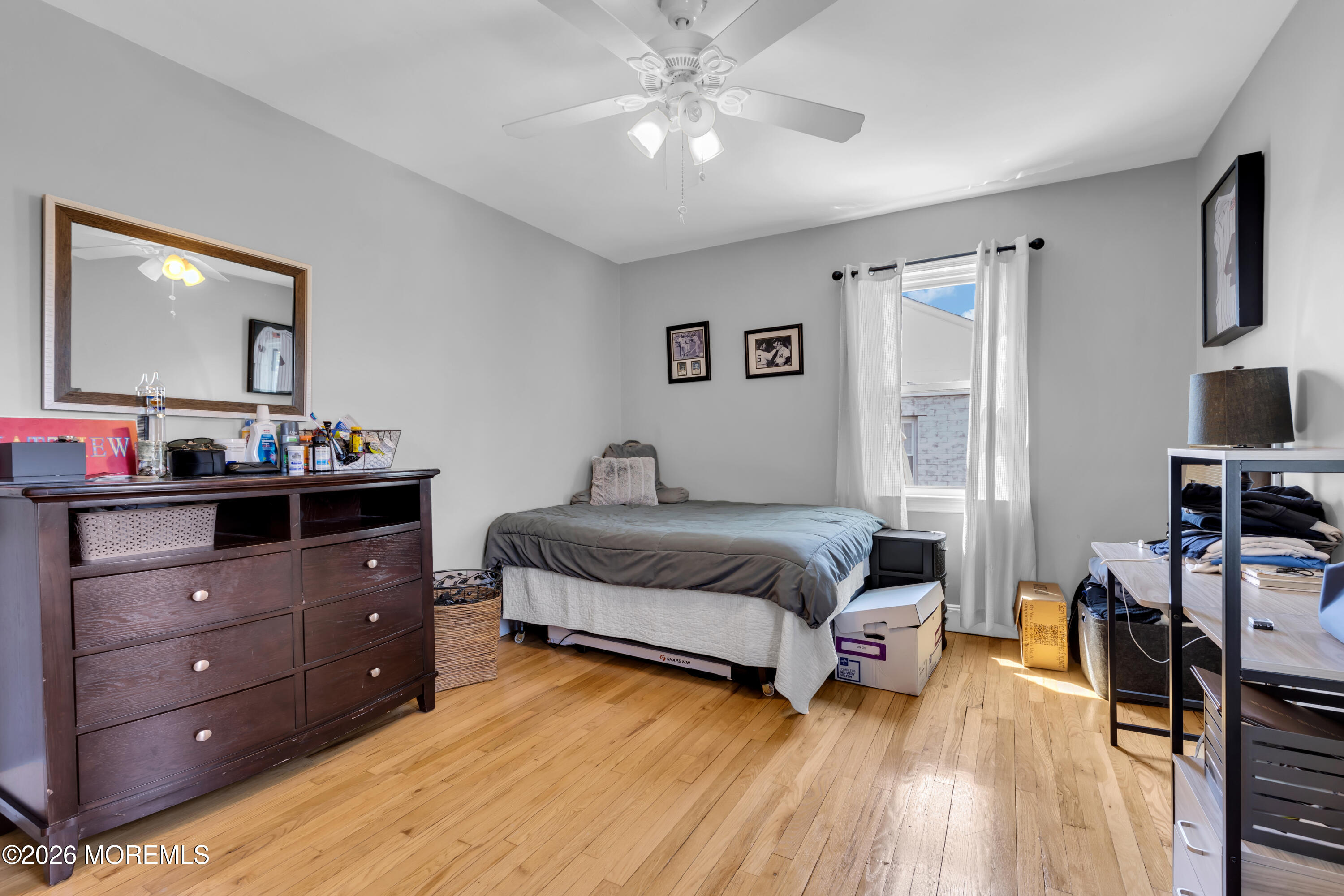 177 Navesink River Road Red Bank, NJ 07701 - Photo 33 of 48 a bedroom with a bed and a flat tv screen on dresser