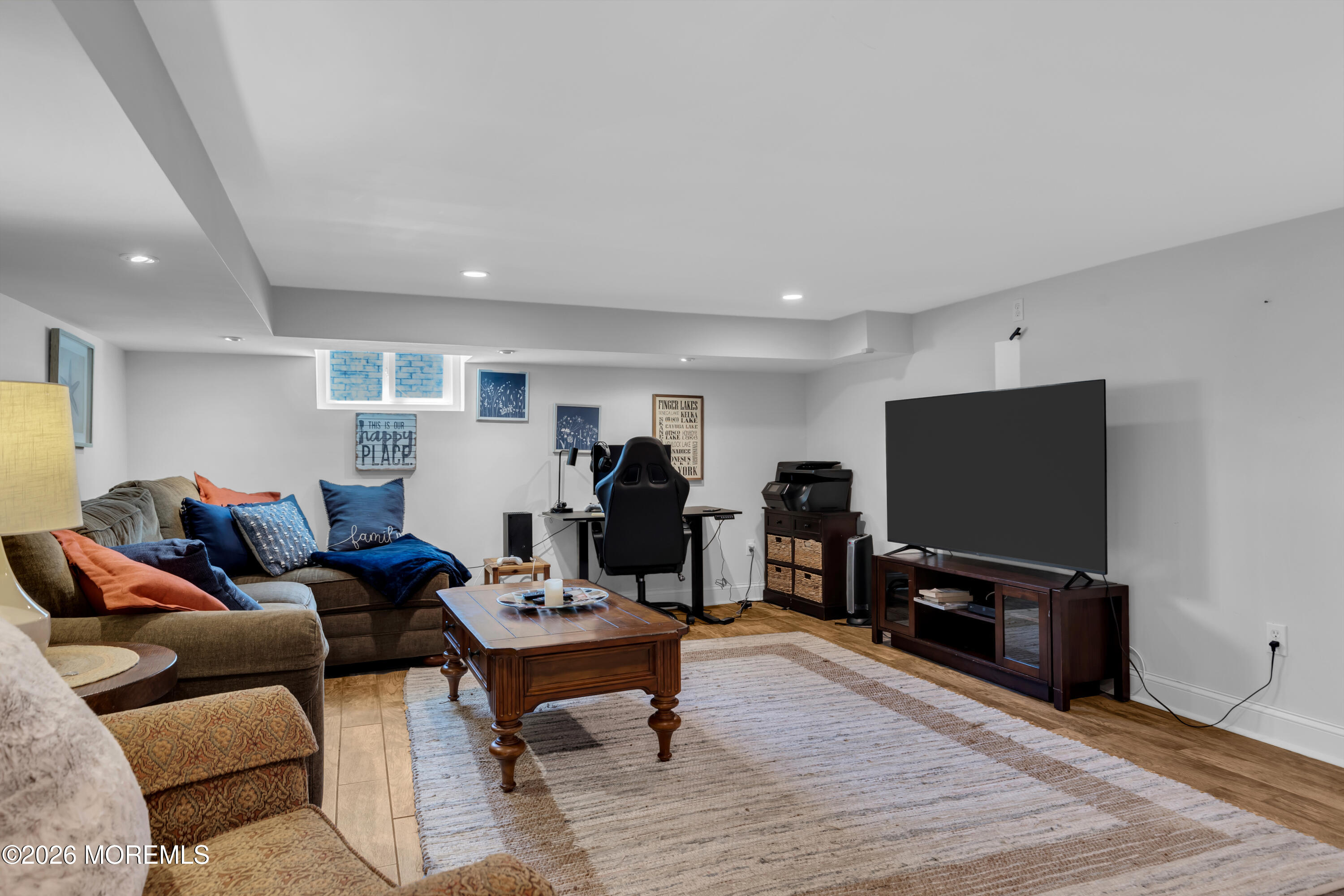 177 Navesink River Road Red Bank, NJ 07701 - Photo 34 of 48 a living room with furniture and a flat screen tv