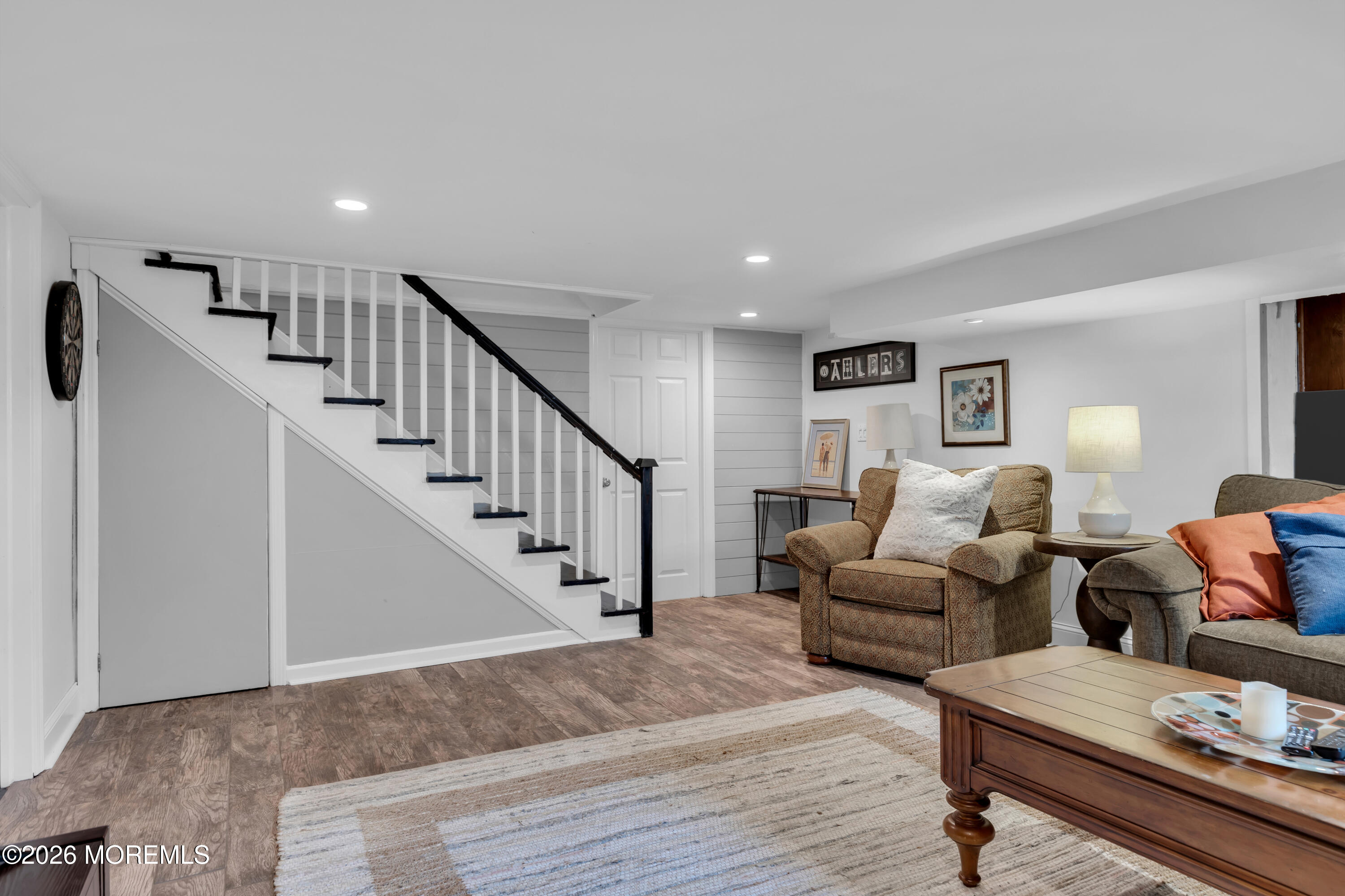 177 Navesink River Road Red Bank, NJ 07701 - Photo 36 of 48 a living room with furniture and a wooden floor