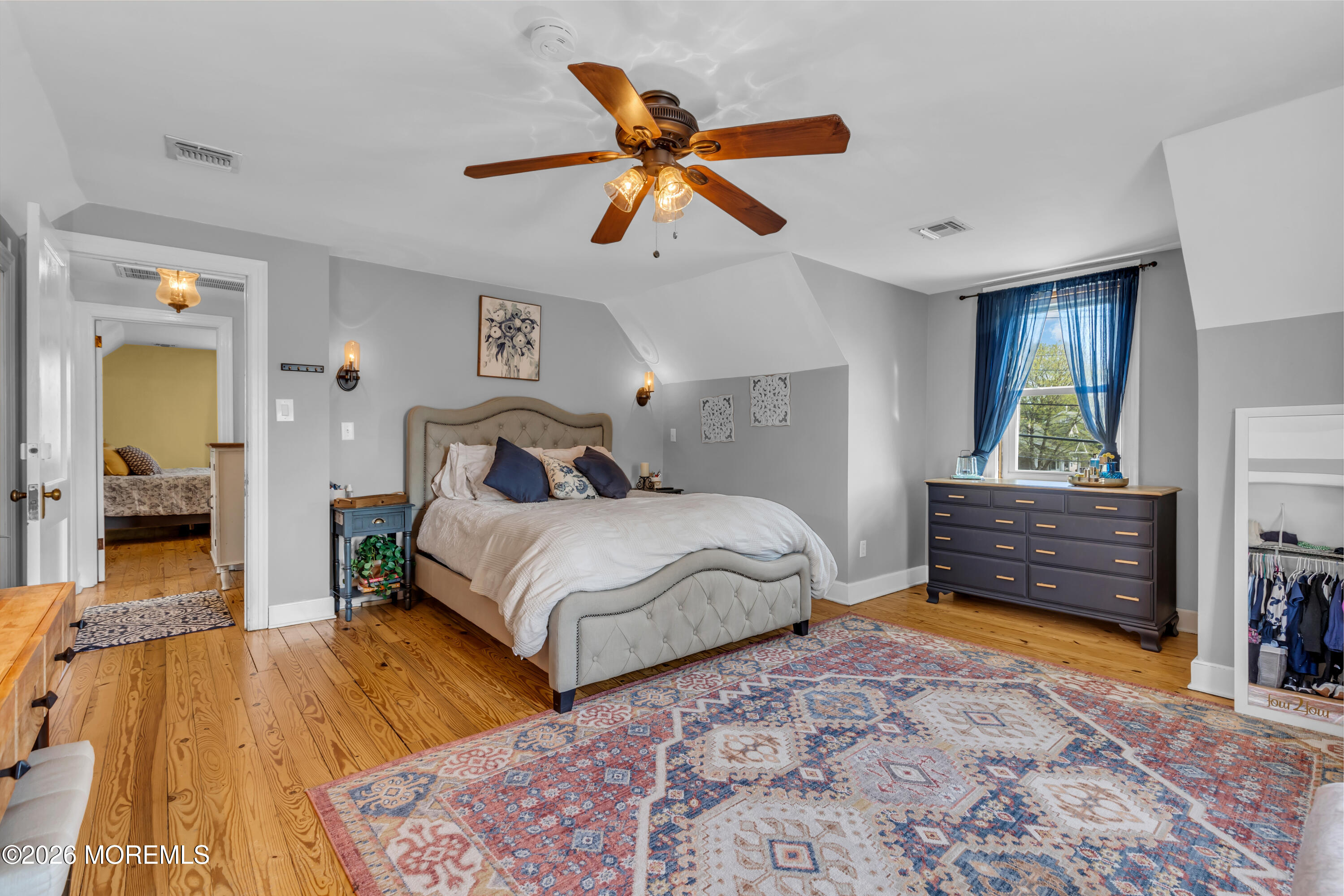 177 Navesink River Road Red Bank, NJ 07701 - Photo 41 of 48 a bedroom with a bed and wooden floor