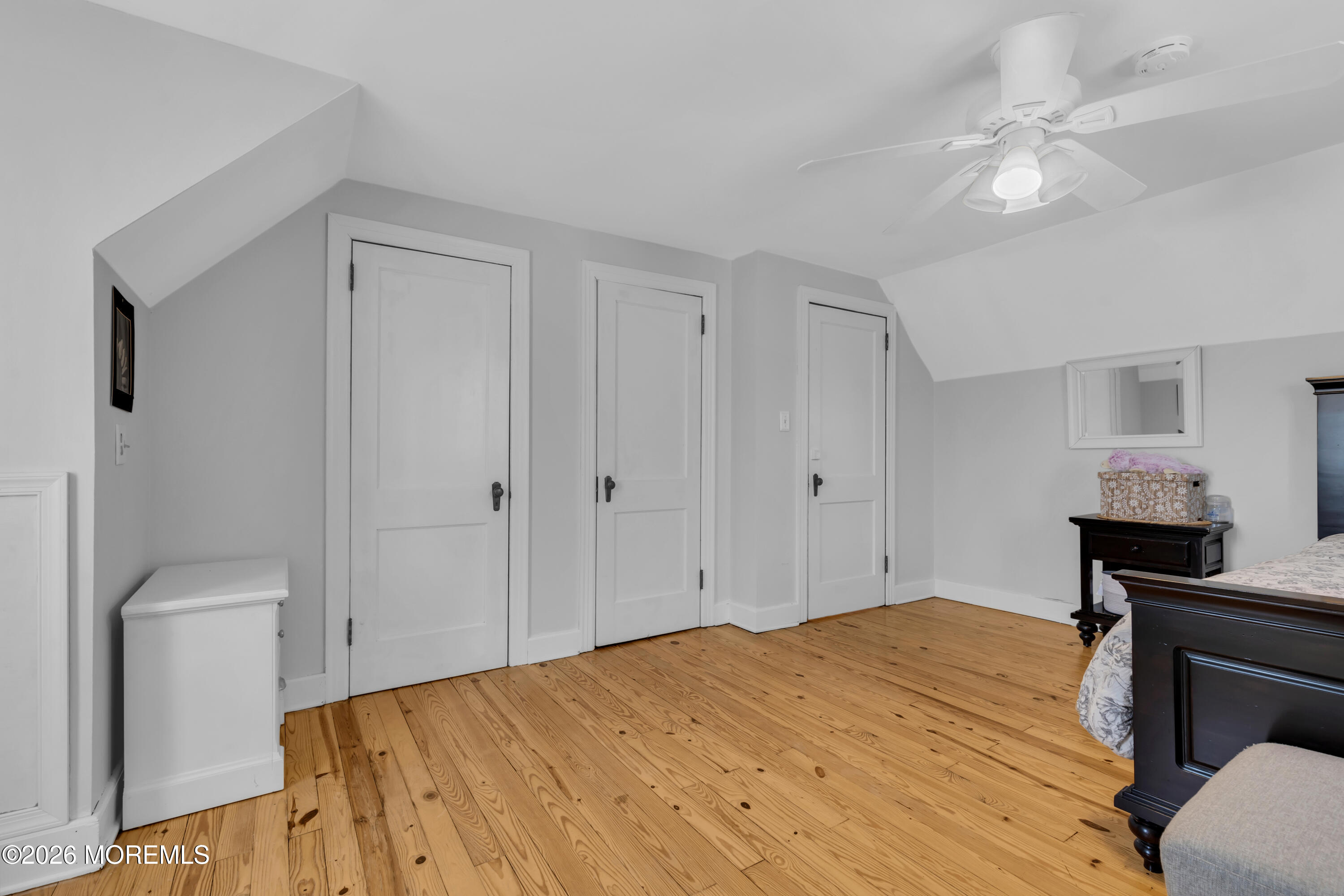 177 Navesink River Road Red Bank, NJ 07701 - Photo 44 of 48 a bedroom with a bed and a chandelier
