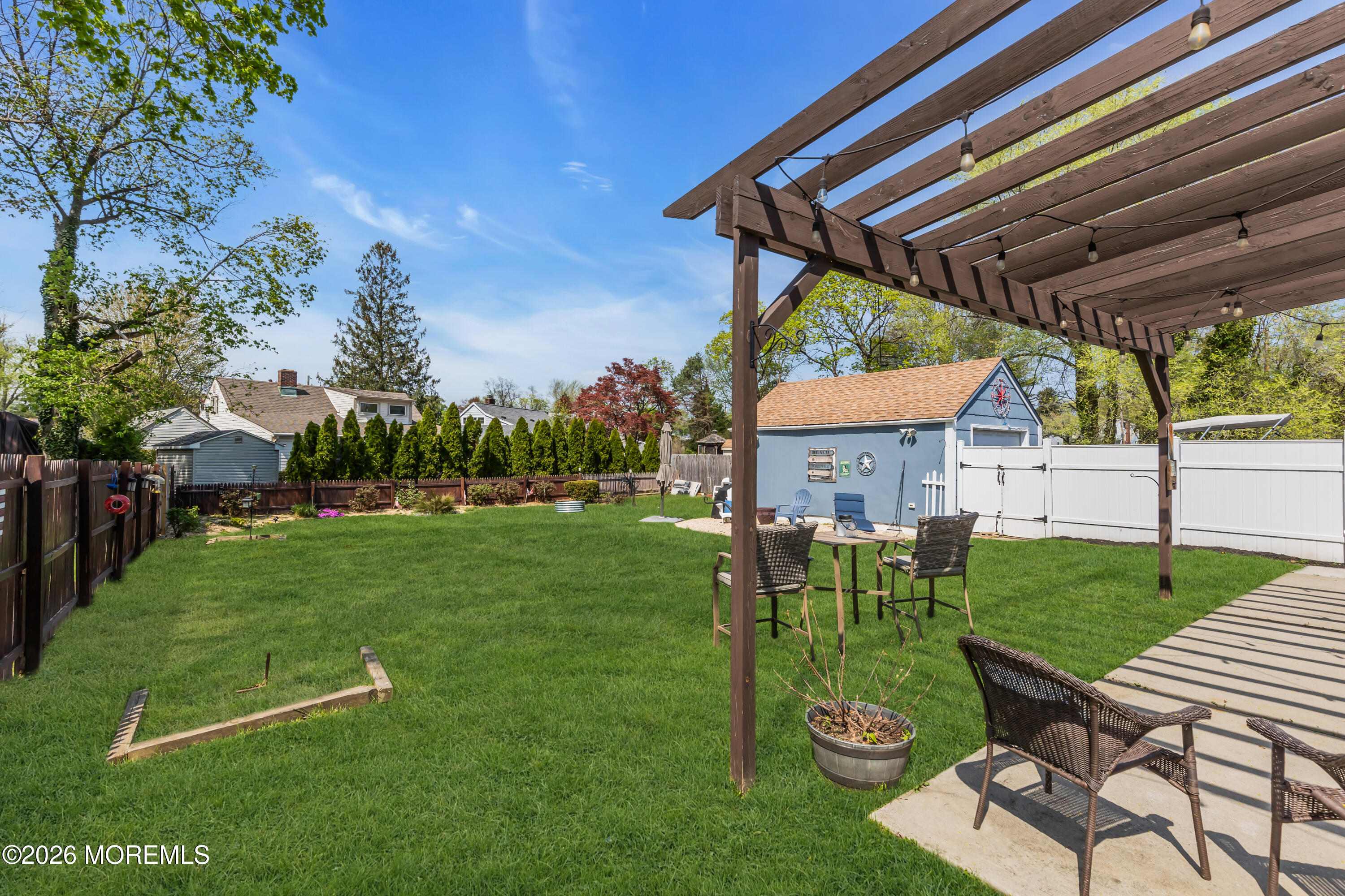 177 Navesink River Road Red Bank, NJ 07701 - Photo 47 of 48 a view of a patio with chair and table