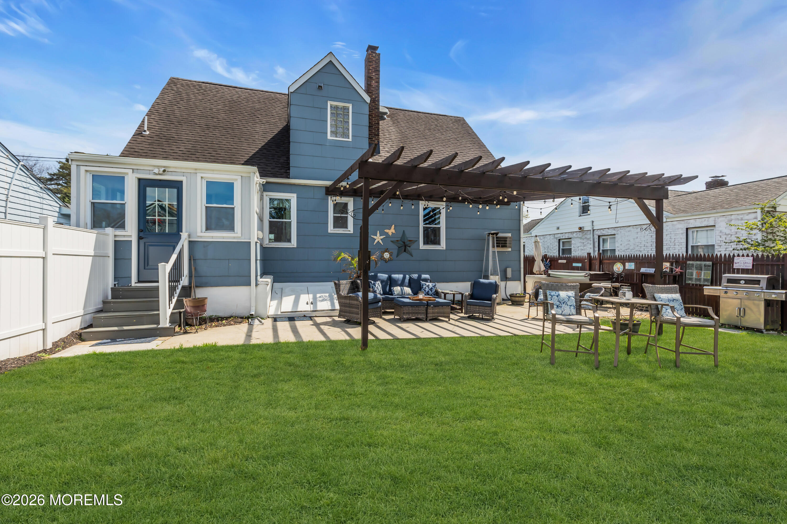 177 Navesink River Road Red Bank, NJ 07701 - Photo 48 of 48 a front view of a house with a garden and patio