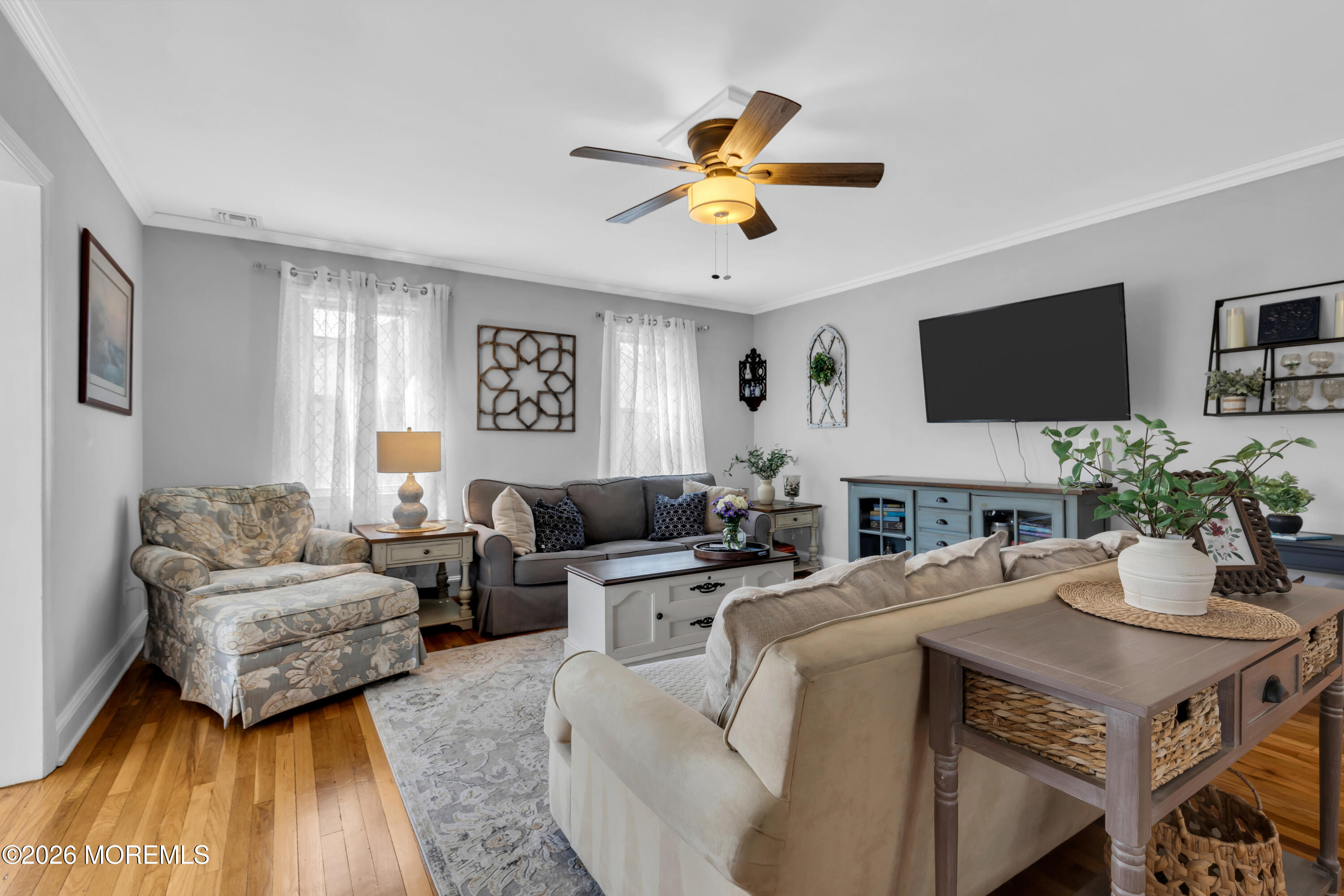 177 Navesink River Road Red Bank, NJ 07701 - Photo 7 of 48 a living room with furniture a fireplace and a flat screen tv