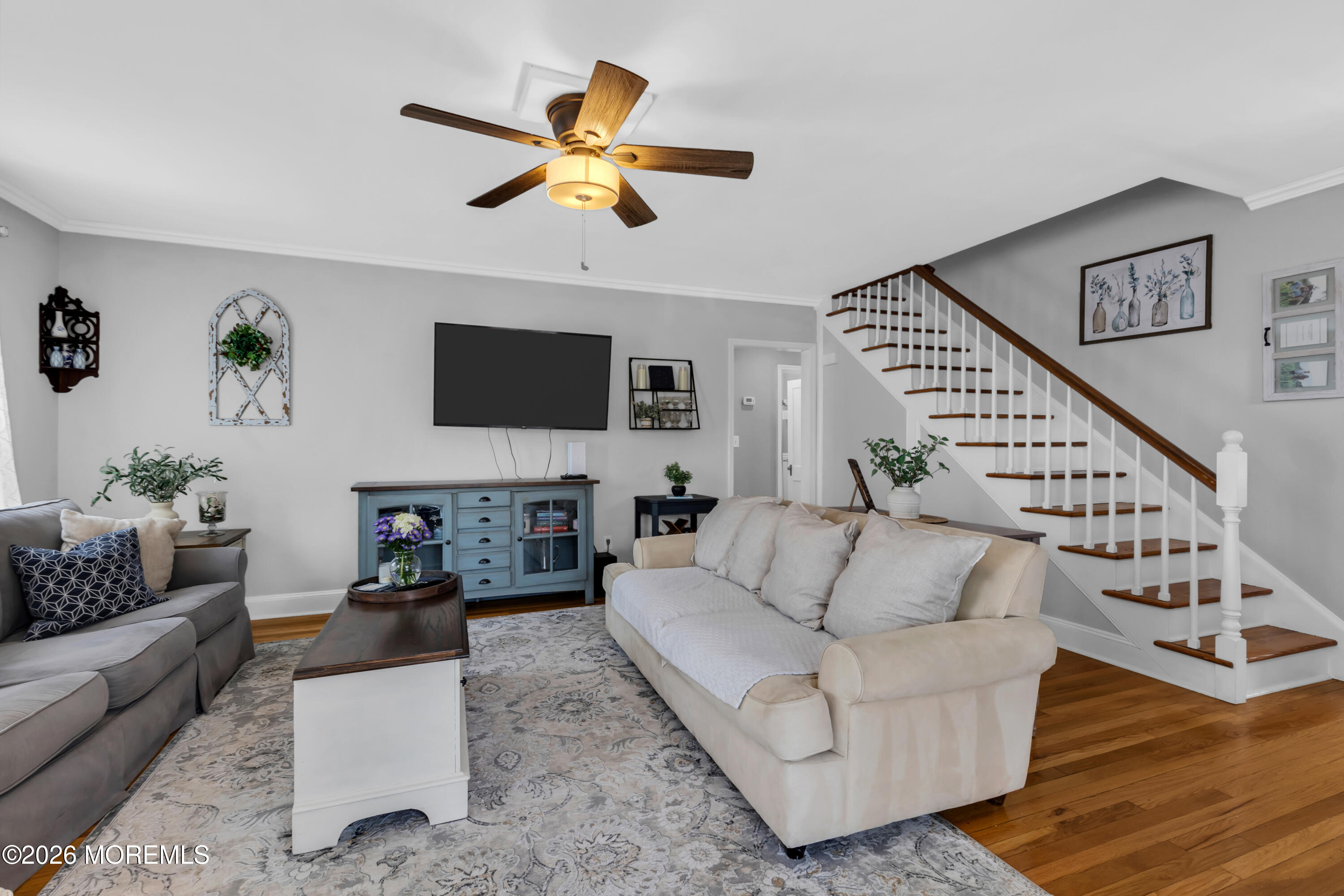 177 Navesink River Road Red Bank, NJ 07701 - Photo 10 of 48 a living room with furniture a fireplace and a flat screen tv