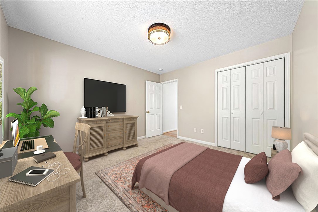 848 Perkins Creek Road Seneca, SC 29678 - Photo 22 of 26 A well-lit bedroom provides ample space for rest and a dedicated workspace.