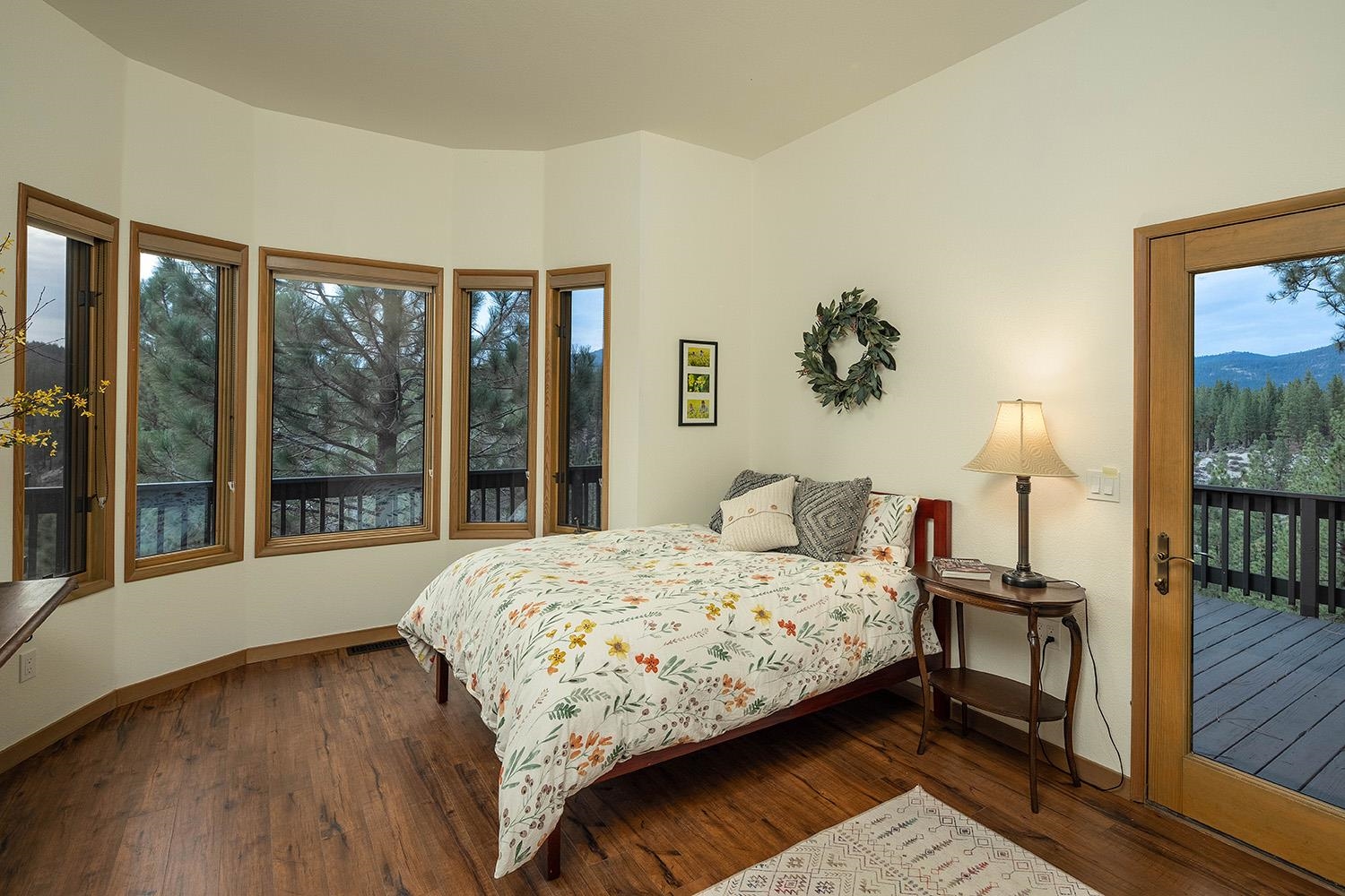 878 Deer Trail Clio, CA 96106 - Photo 11 of 21 a bedroom with a bed and a large window