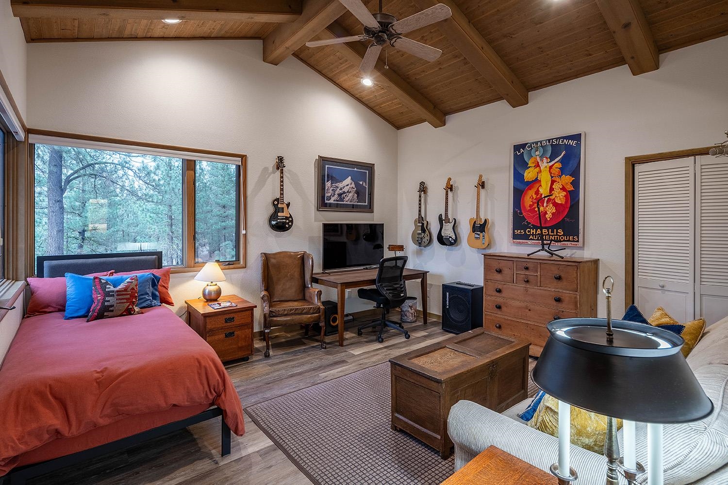 878 Deer Trail Clio, CA 96106 - Photo 13 of 21 a living room with furniture a fireplace and a large window
