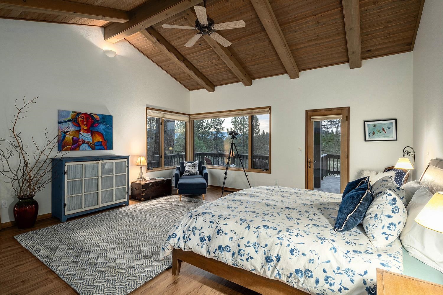 878 Deer Trail Clio, CA 96106 - Photo 9 of 21 a living room with furniture large window and a wooden floor