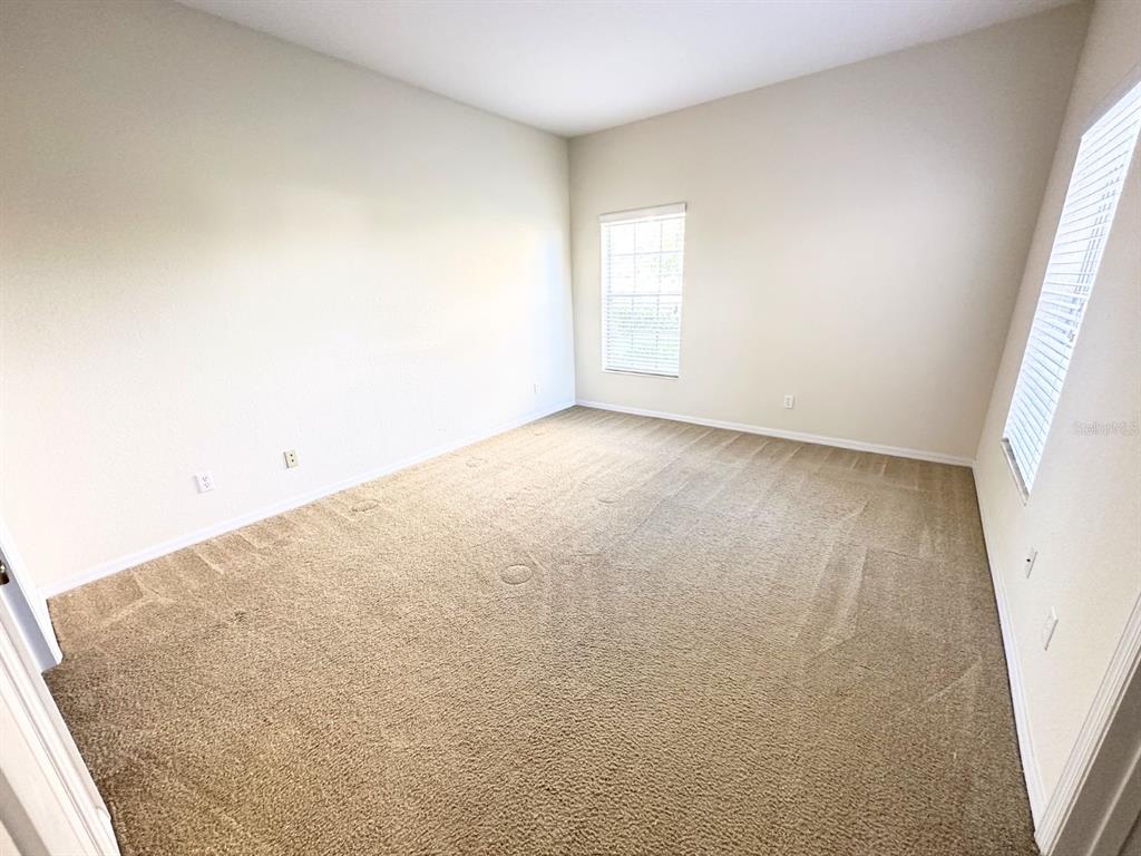 201 Eagle Pond Drive Winter Haven, FL 33884 - Photo 12 of 13 an empty room with windows