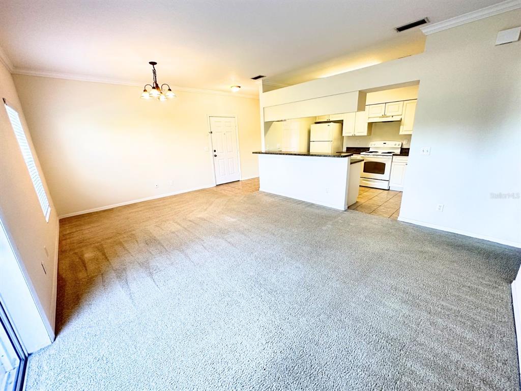 201 Eagle Pond Drive Winter Haven, FL 33884 - Photo 2 of 13 a view of a kitchen with a sink and a refrigerator