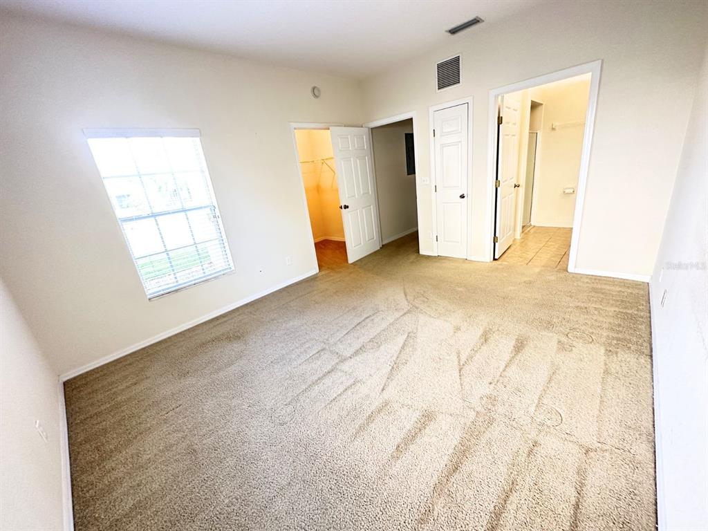 201 Eagle Pond Drive Winter Haven, FL 33884 - Photo 5 of 13 an empty room with windows and closet
