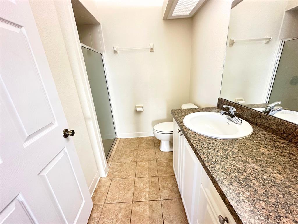201 Eagle Pond Drive Winter Haven, FL 33884 - Photo 7 of 13 a bathroom with sink and mirror