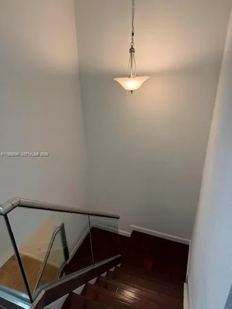 a view of room with wooden floor
