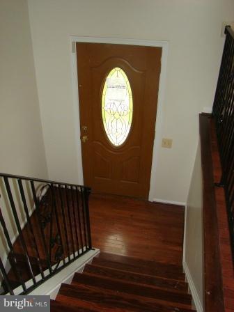 3370 Malcolm Road Brandywine, MD 20613 - Photo 2 of 19 a view of a hallway with wooden floor
