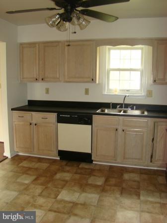 3370 Malcolm Road Brandywine, MD 20613 - Photo 12 of 19 a kitchen with granite countertop a sink and cabinets
