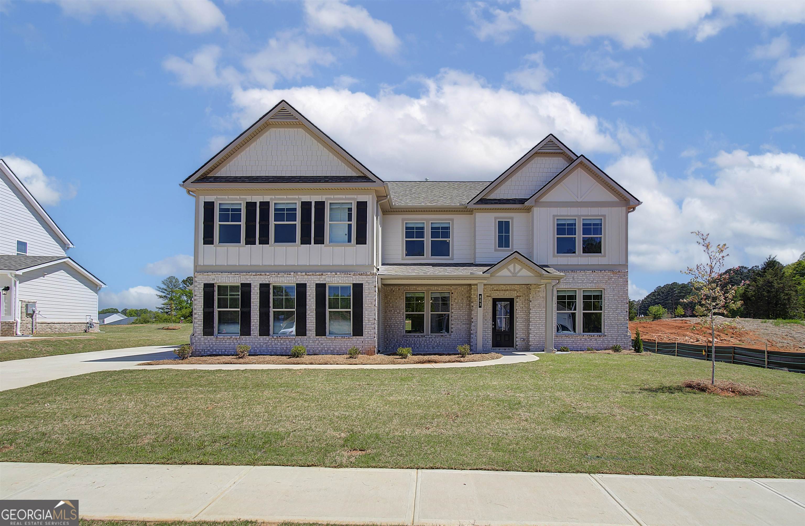 front view of a house with a yard