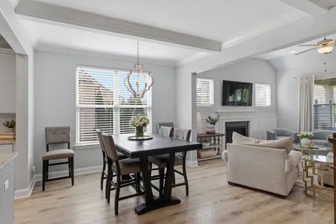 a view of a livingroom with furniture window and wooden floor