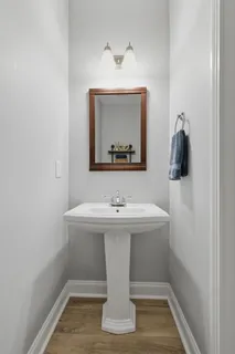 a bathroom with a sink and mirror