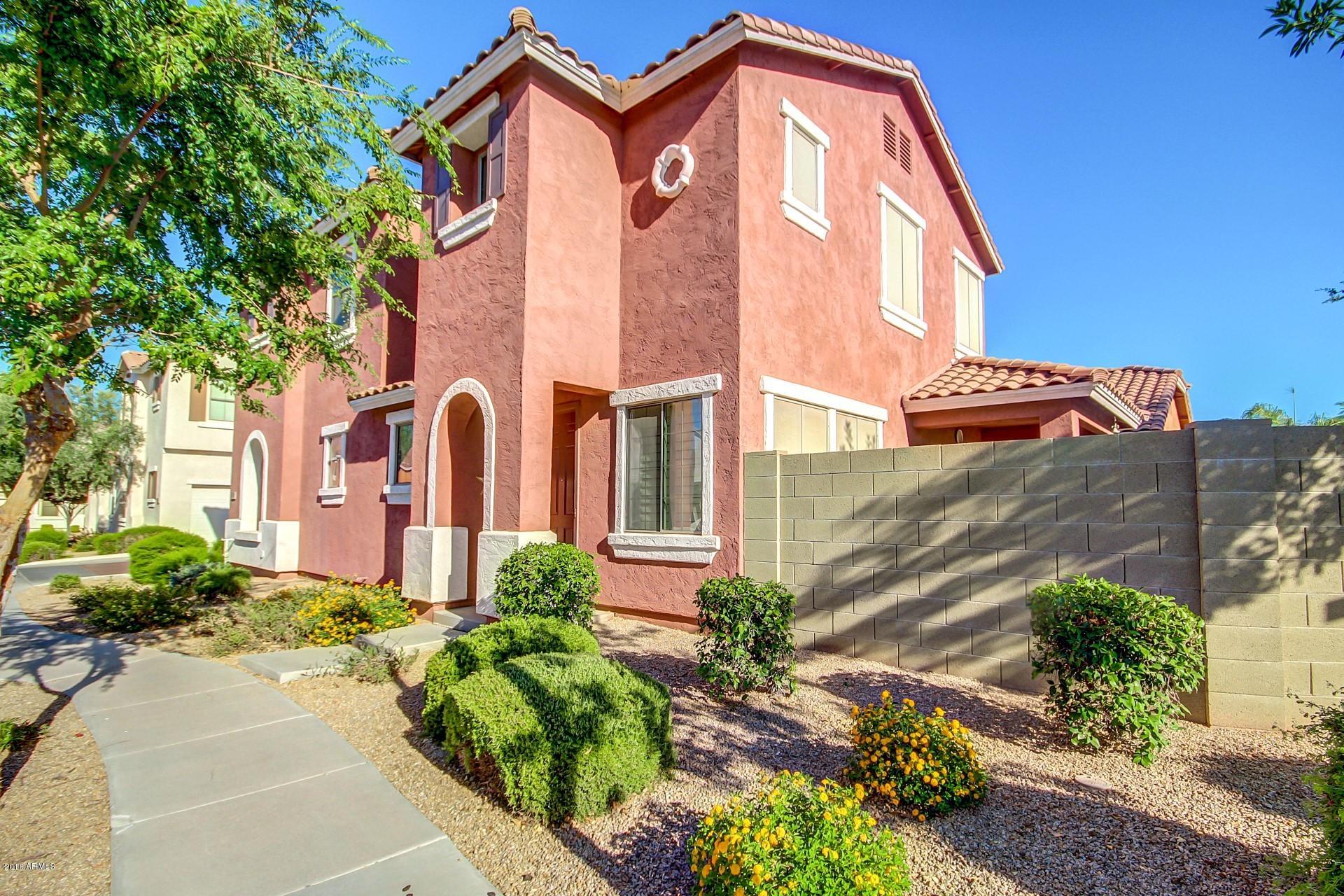 883 East Devon Road Gilbert, AZ 85296 - Photo 1 of 27 a front view of a house