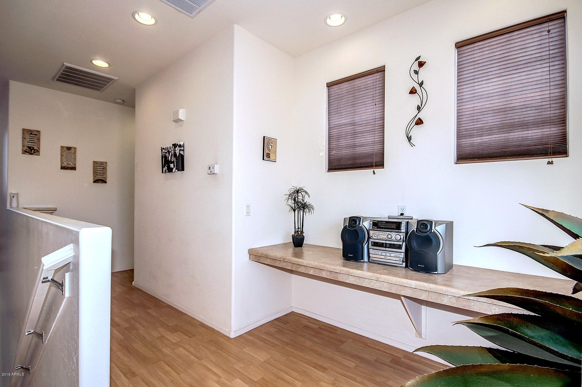 883 East Devon Road Gilbert, AZ 85296 - Photo 15 of 27 a kitchen with a refrigerator and sink