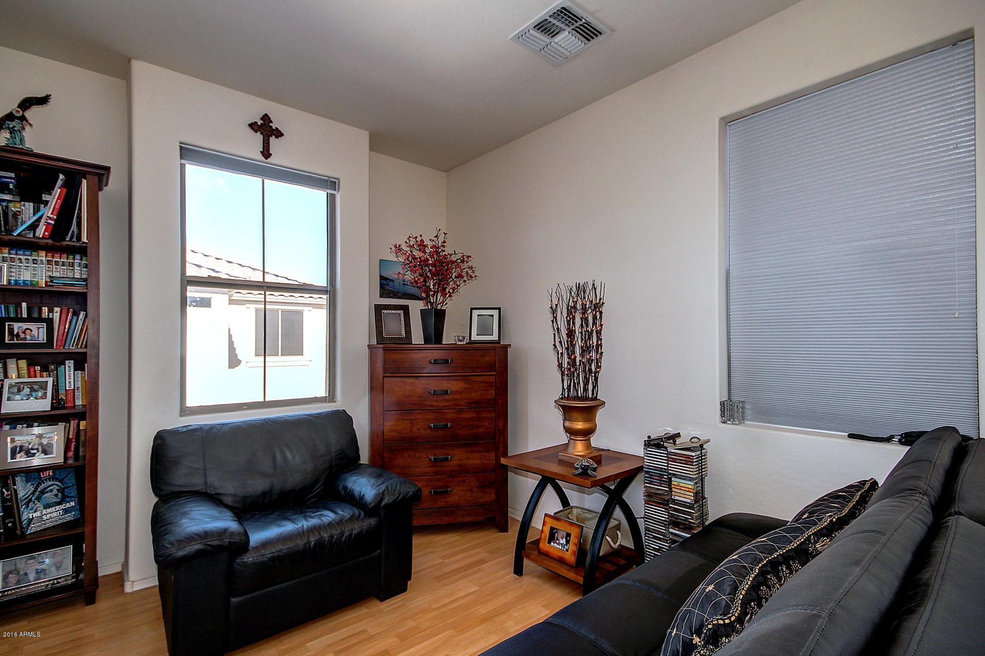 883 East Devon Road Gilbert, AZ 85296 - Photo 23 of 27 a bedroom with furniture and a window