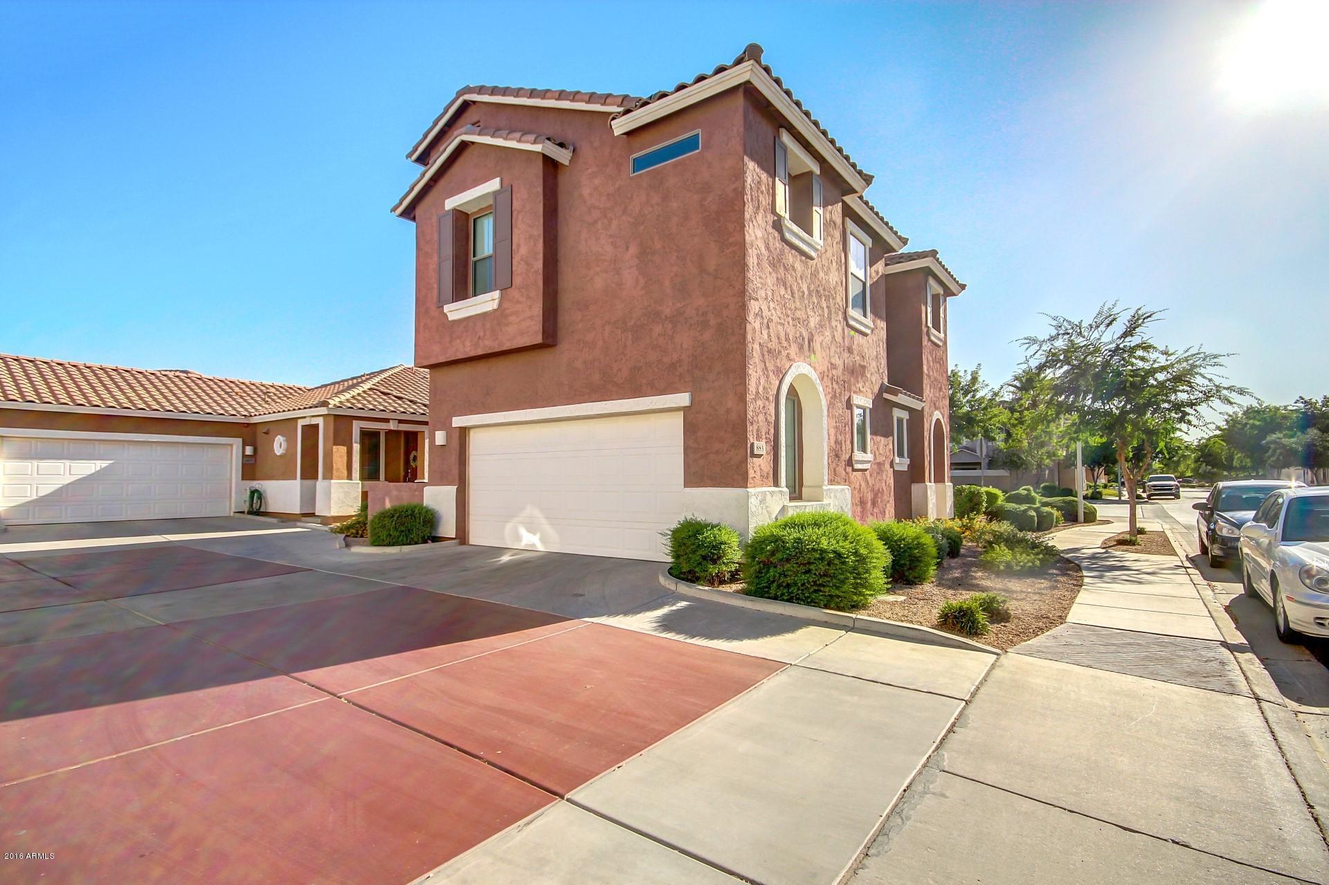 883 East Devon Road Gilbert, AZ 85296 - Photo 27 of 27 a front view of a house with a yard and a garage