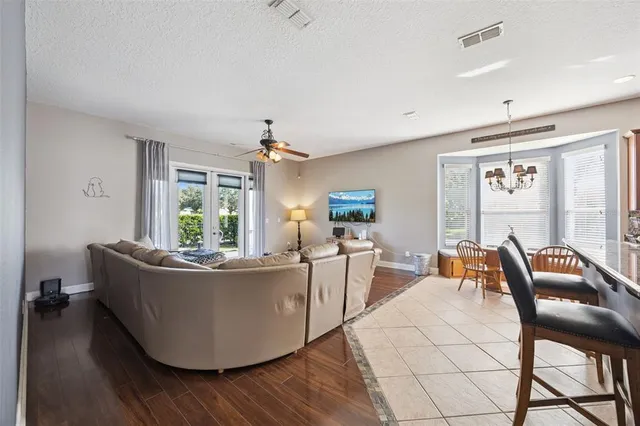 a living room with furniture or couch and a wooden floor