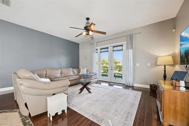 a living room with furniture and a large window